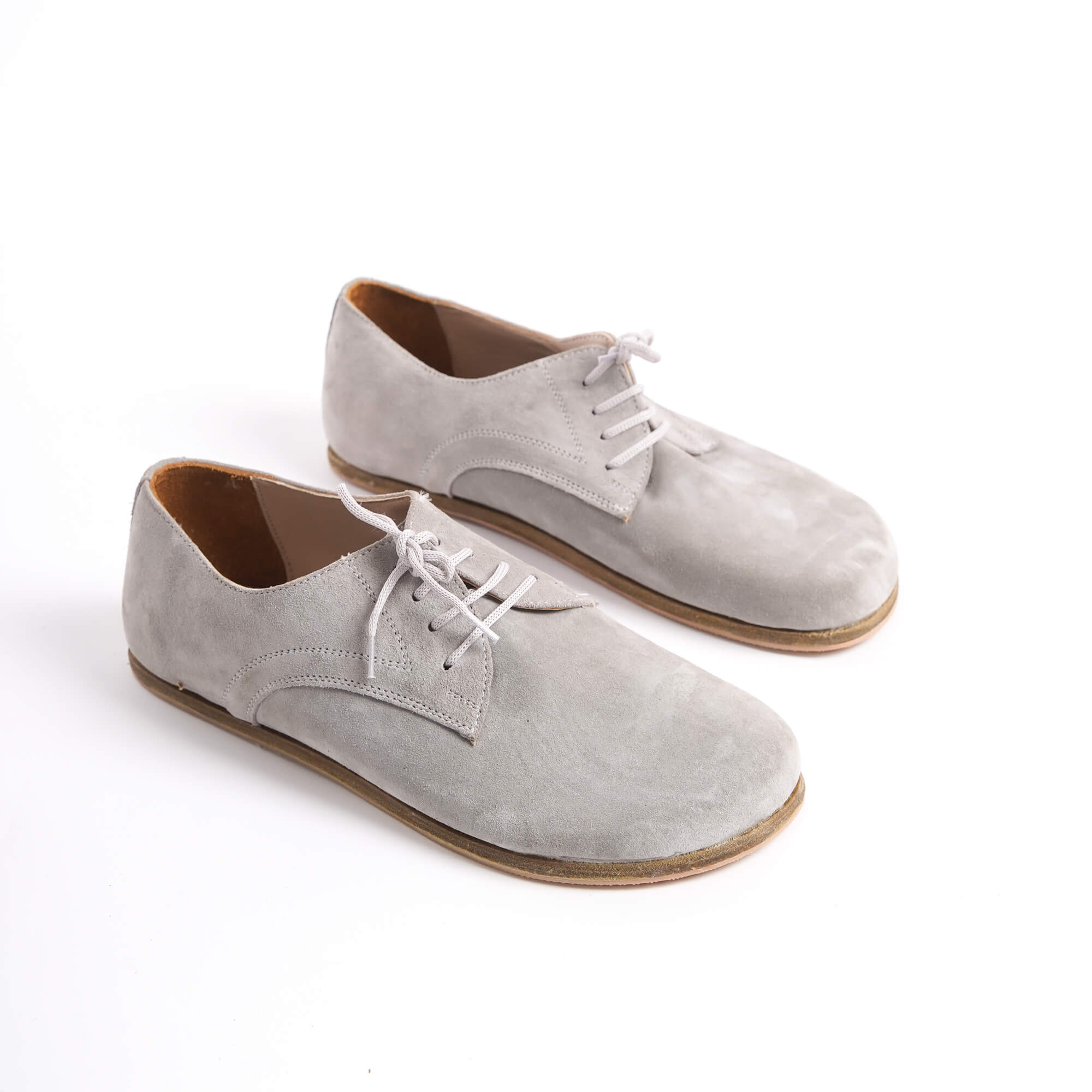 Walk with confidence and ease in Pelanir men's grey suede oxford shoes, featuring a minimalist zero-drop design that supports natural foot movement - Check them out at Pelanir.com!