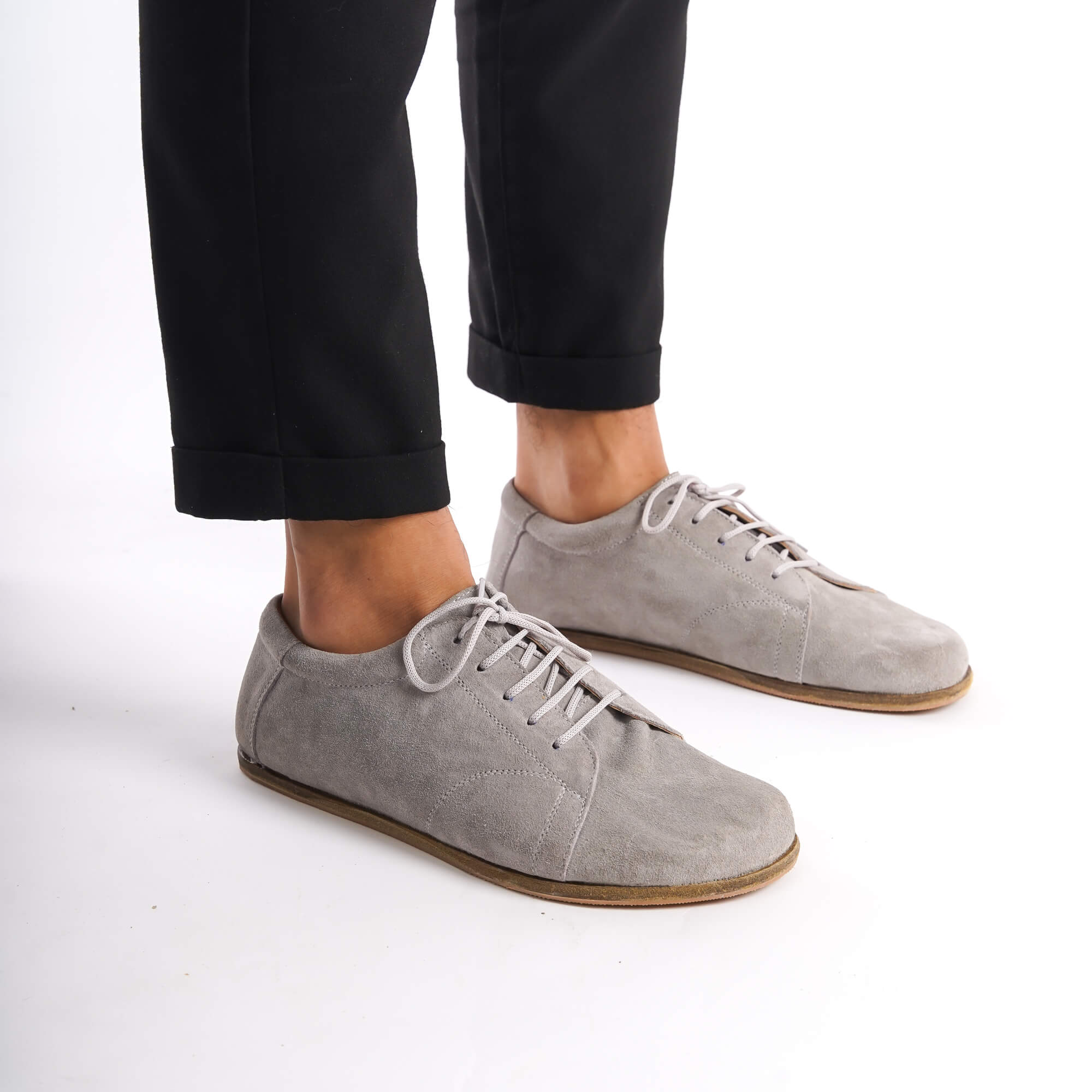 Men's grey suede barefoot sneakers with a zero-drop design, offering superior comfort and a natural fit.