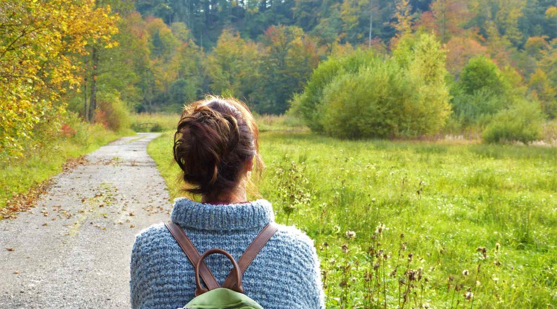 A women choose a barefoot shoes and walking in nature