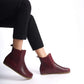 Stylish burgundy Chelsea boots featuring a wide toe box and made from genuine natural leather. Perfect for a chic and comfortable look.