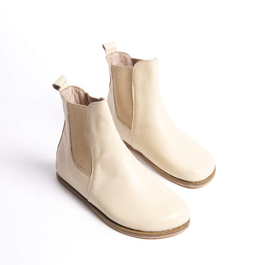 Cream Chelsea boots for women with a wide toe box made from natural leather. Perfect for a minimalist look and exceptional comfort.