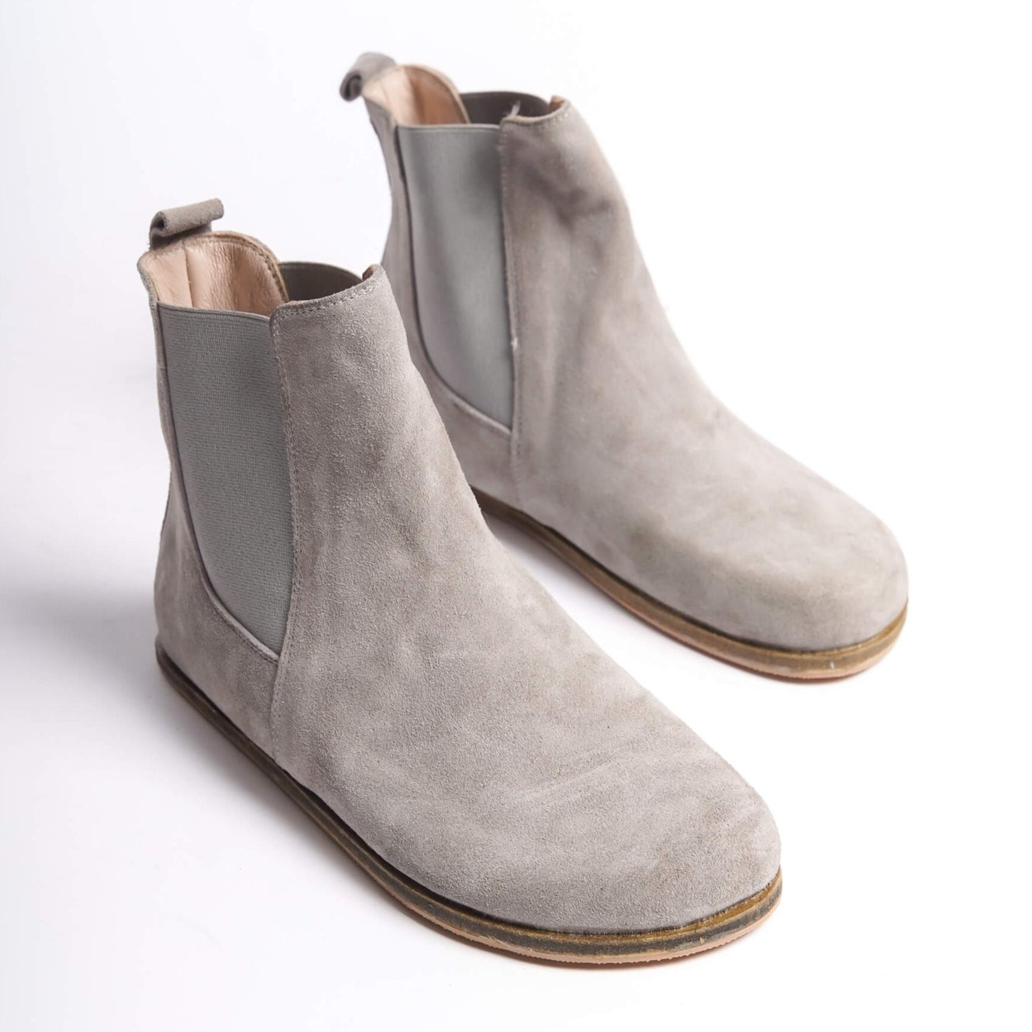 Gray suede Chelsea boots for women with a wide toe box, crafted from natural leather. Ideal for a stylish minimalist look and comfort.