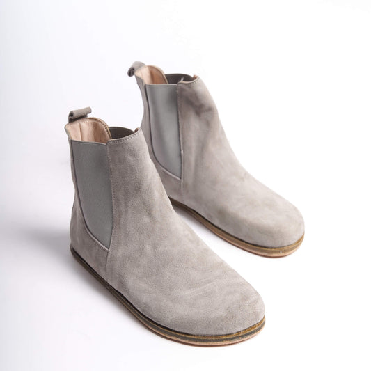 Gray suede Chelsea boots for women with a wide toe box, crafted from natural leather. Ideal for a stylish minimalist look and comfort.