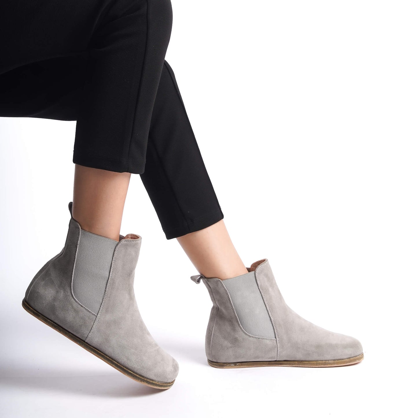 Elegant gray suede Chelsea boots featuring a wide toe box and crafted from genuine natural leather. Perfect for comfort and style.