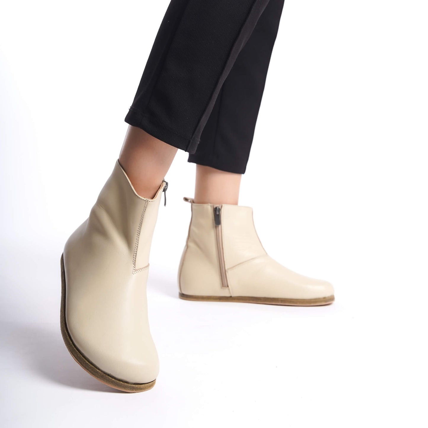 Women’s beige chelsea boots crafted with a wide toe box, ergonomic soles, and minimal design, ideal for earthing.