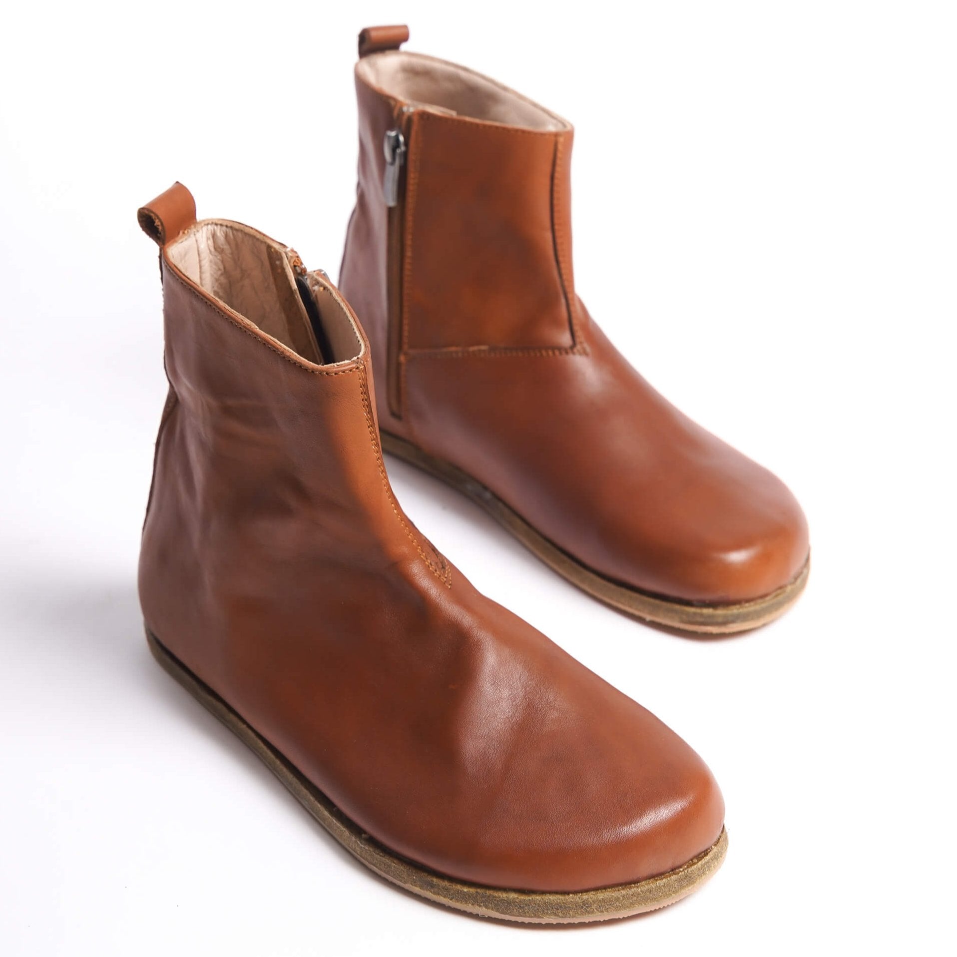 Tan brown women's wide toe box boots with ergonomic soles. Perfect minimalist design for stylish earthing shoes.