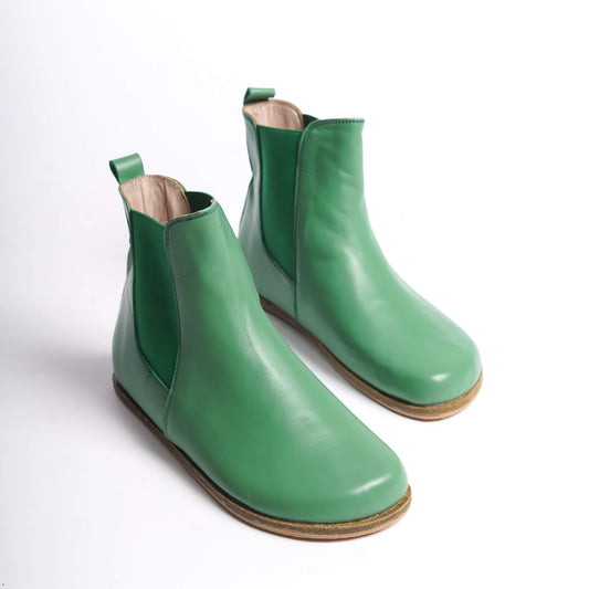 Green Chelsea boots for women with a wide toe box, crafted from natural leather. Ideal for a minimalist and comfortable style