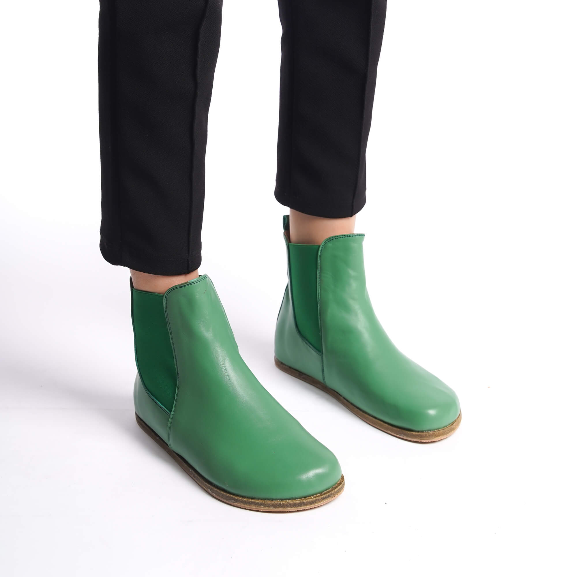 Green natural leather Chelsea boots with a wide toe box for women. Offering minimalist design and exceptional comfort.