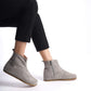 Gray suede wide boots for women, featuring ergonomic soles and a minimalist design for comfortable earthing.