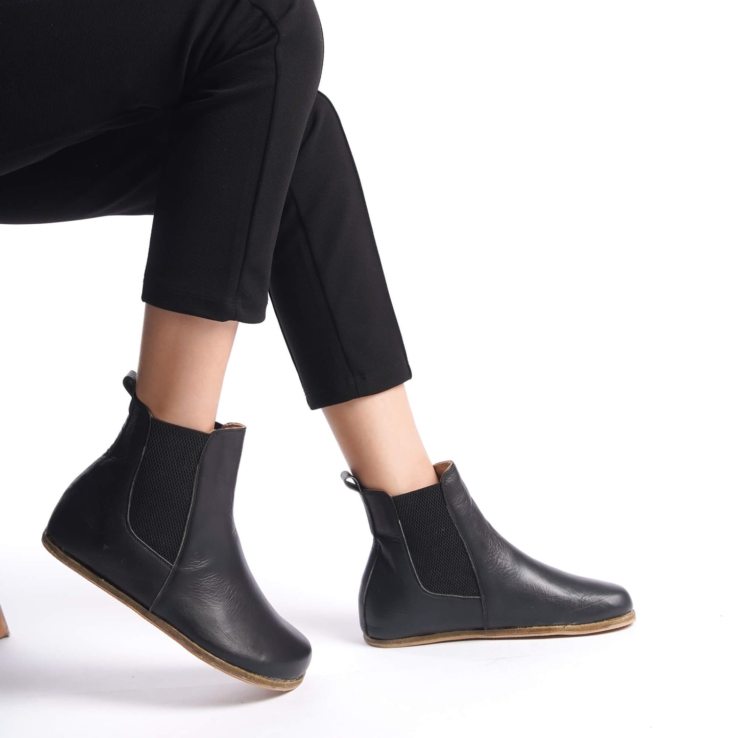 Stylish black Chelsea boots featuring a wide toe box and made from genuine natural leather. Perfect for a chic and comfortable look.