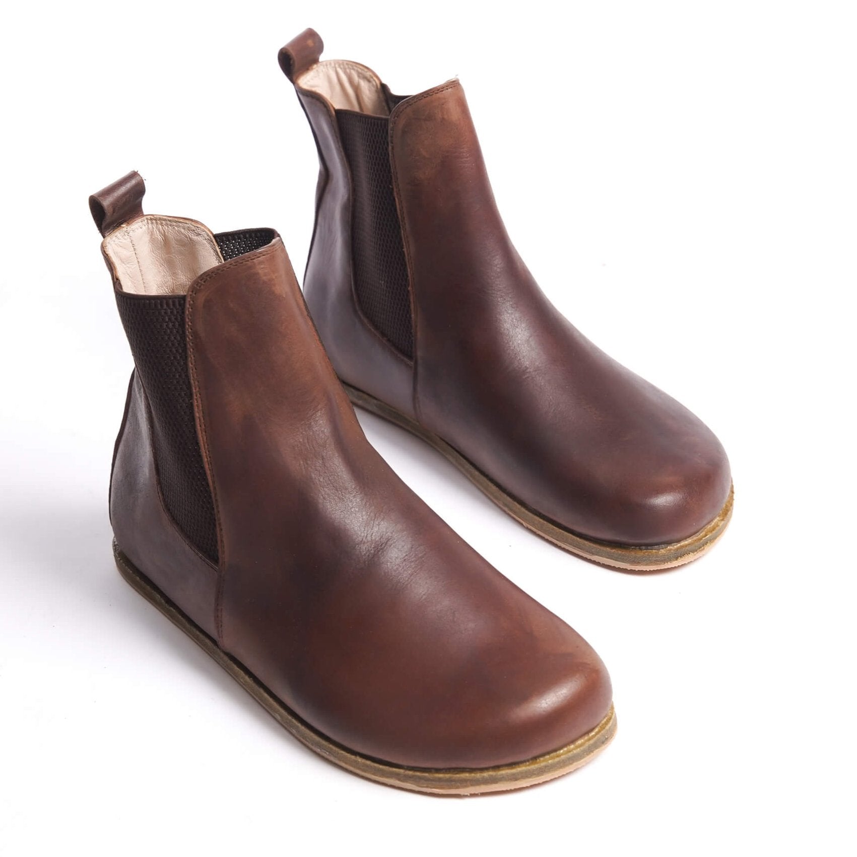 Brown Chelsea boots for women with a wide toe box, made from natural leather. Perfect for a stylish minimalist look and comfort.