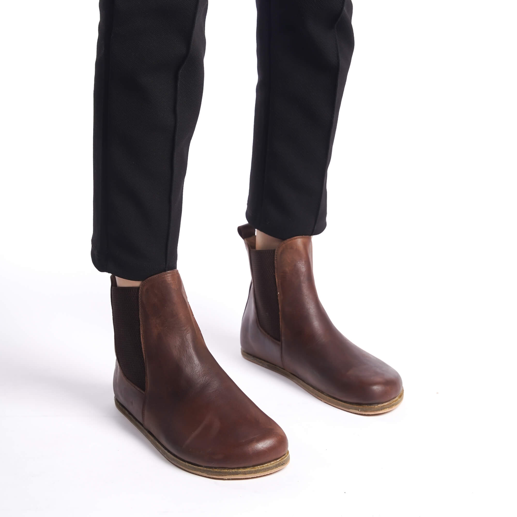 Brown-colored natural leather Chelsea boots with a wide toe box for women. Combining minimalist design with maximum comfort.