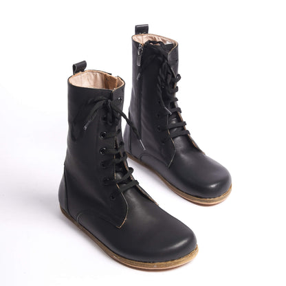 High ankle women's winter boots in black, made from genuine natural leather. Combining style and comfort with every step.