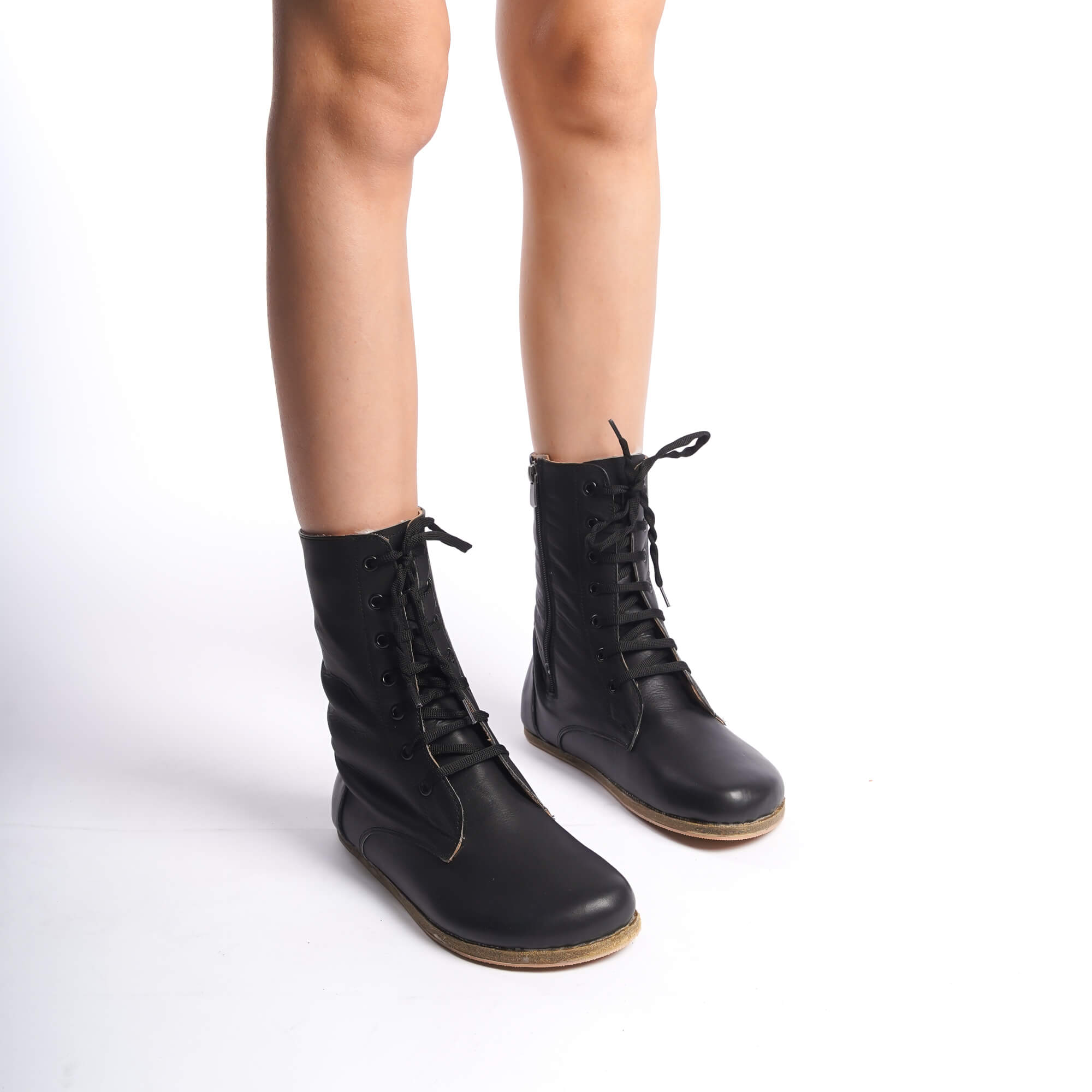Black women’s boots designed with genuine natural leather. Lace-up and side zipper design offers both practicality and elegance.