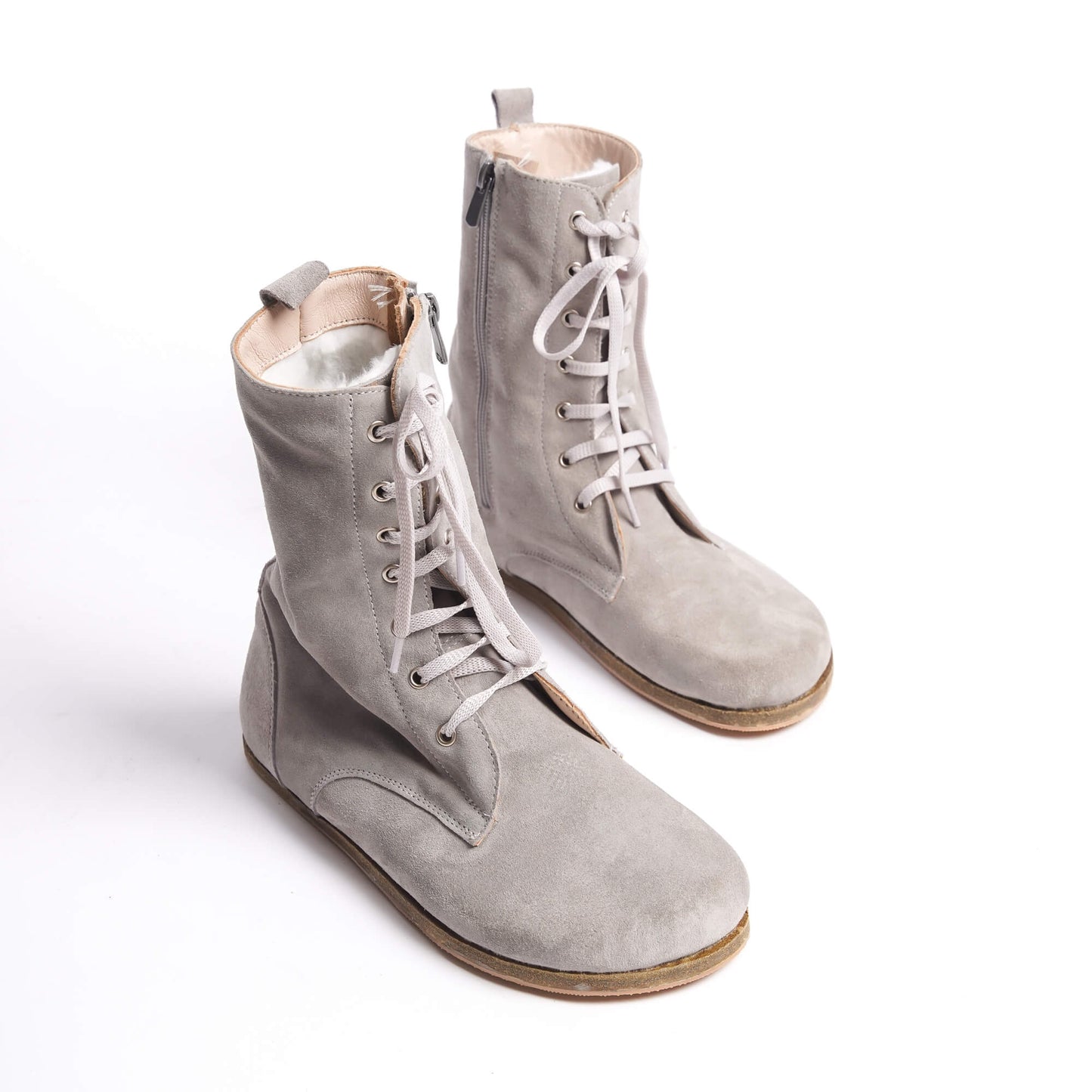 Women’s high ankle lace-up boots made from genuine gray suede leather.