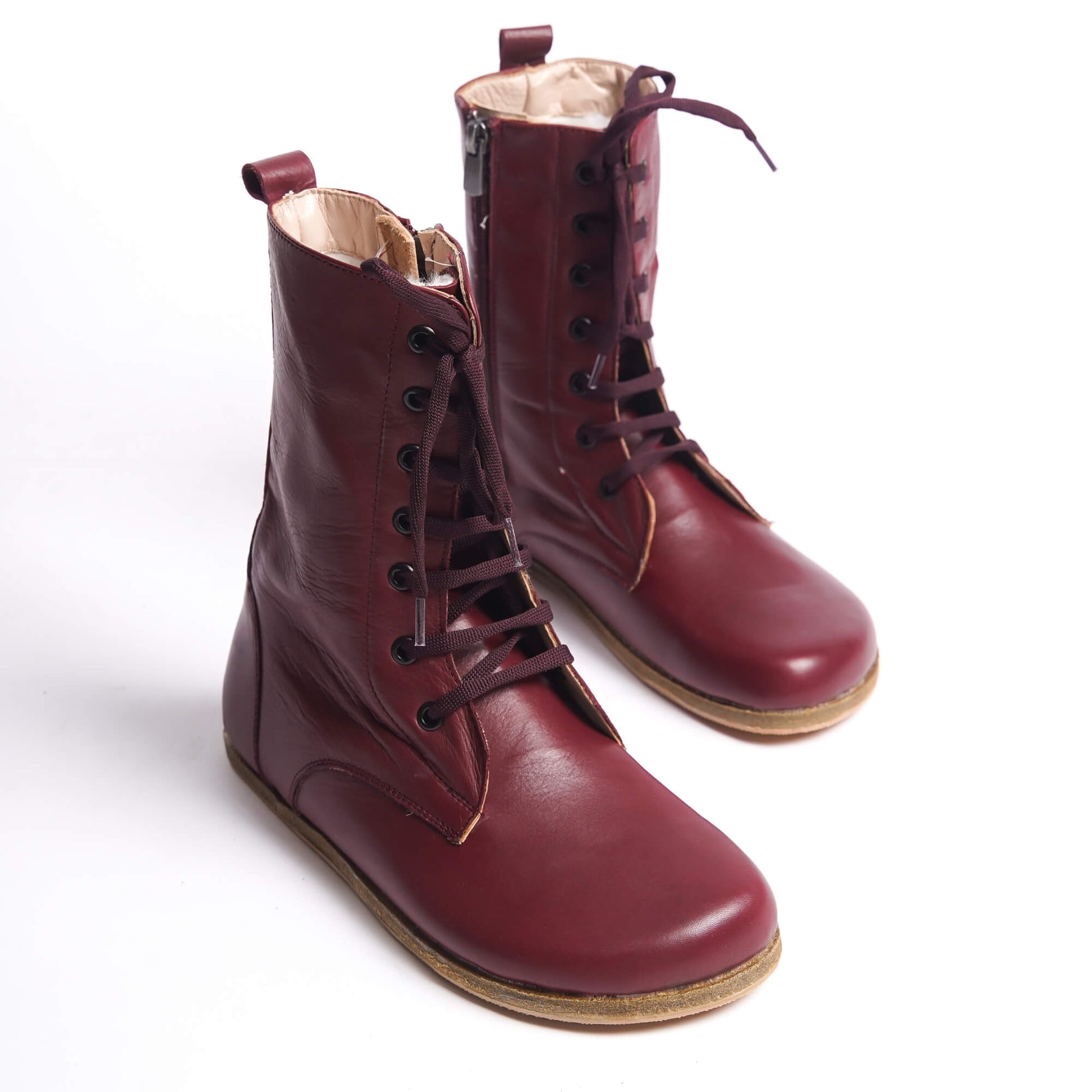 Women’s high ankle lace-up boots made from genuine natural leather in burgundy.