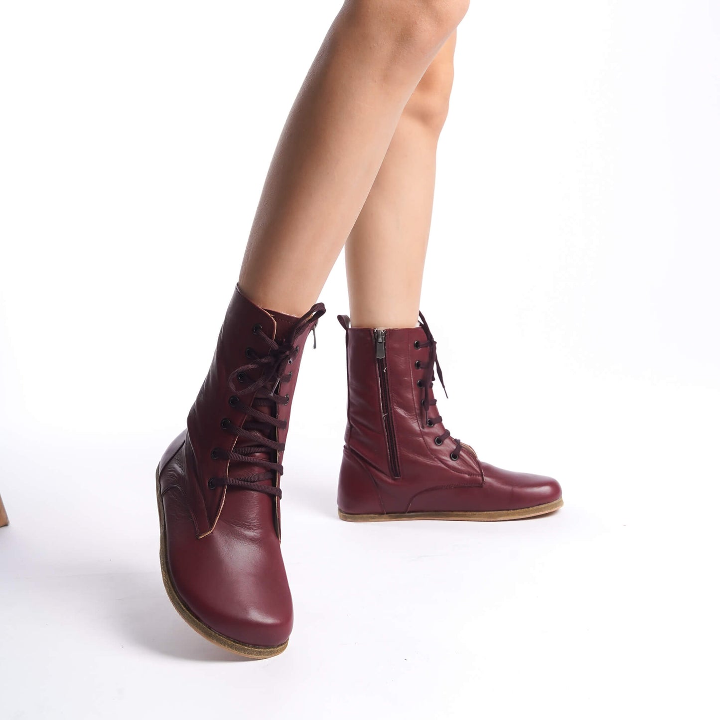 Burgundy lace-up women’s boots designed with genuine natural leather. 