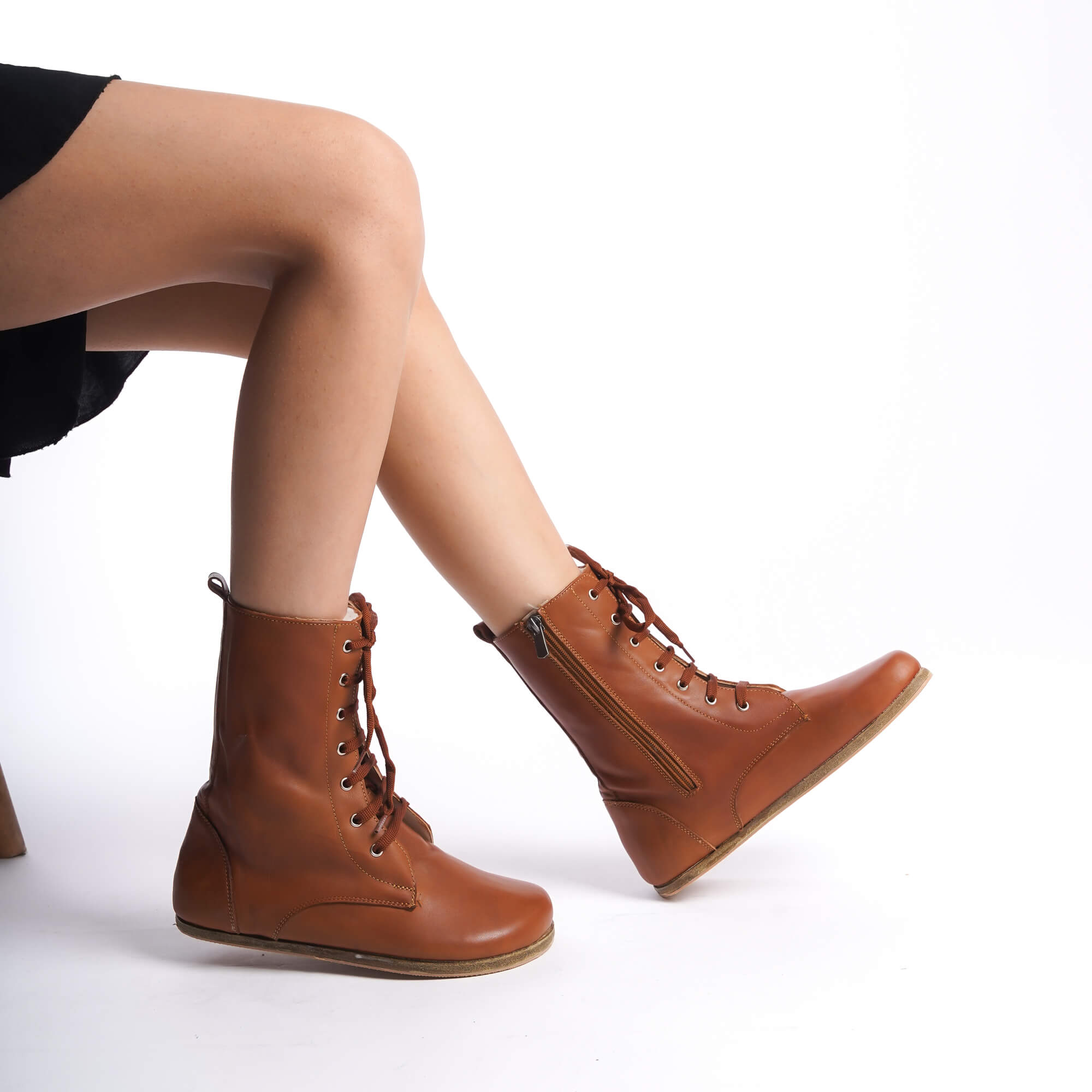 Women’s high ankle lace-up boots made from genuine natural leather in tan brown. Lightweight and flexible sole for maximum comfort.