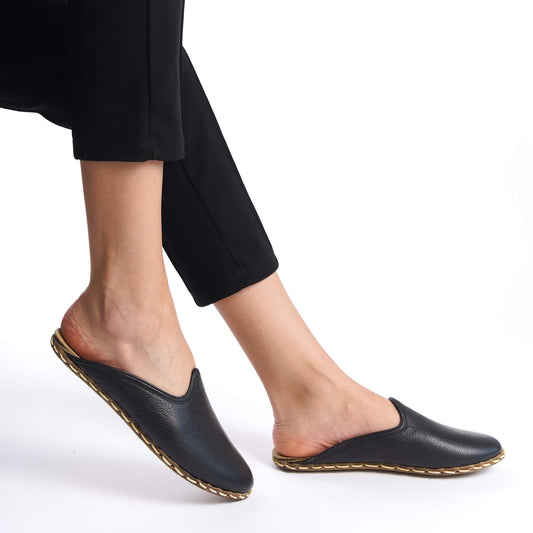 Premium black leather mules for women, crafted with superior stitching.