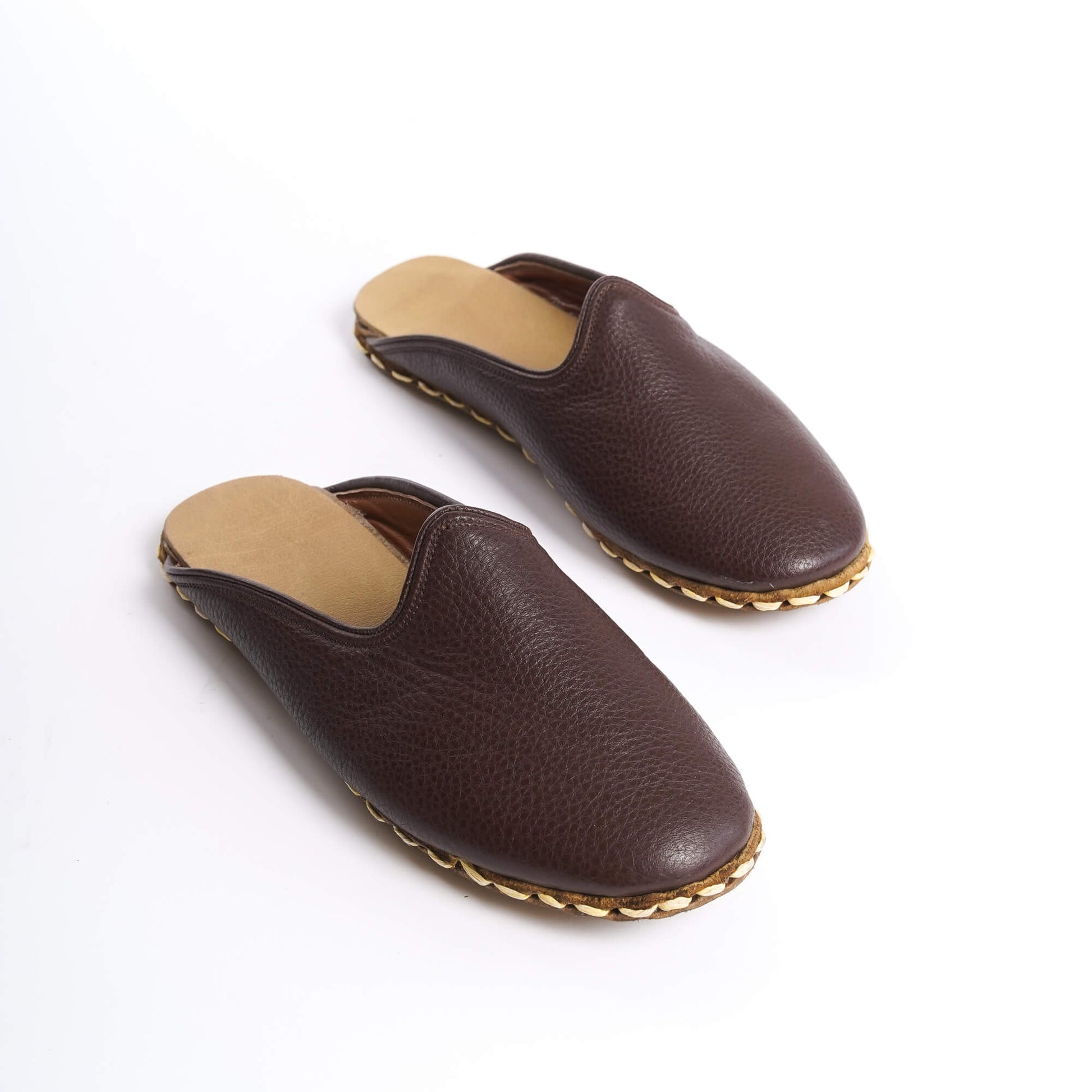 Rich coffee-brown leather summer slippers with artisanal stitching.