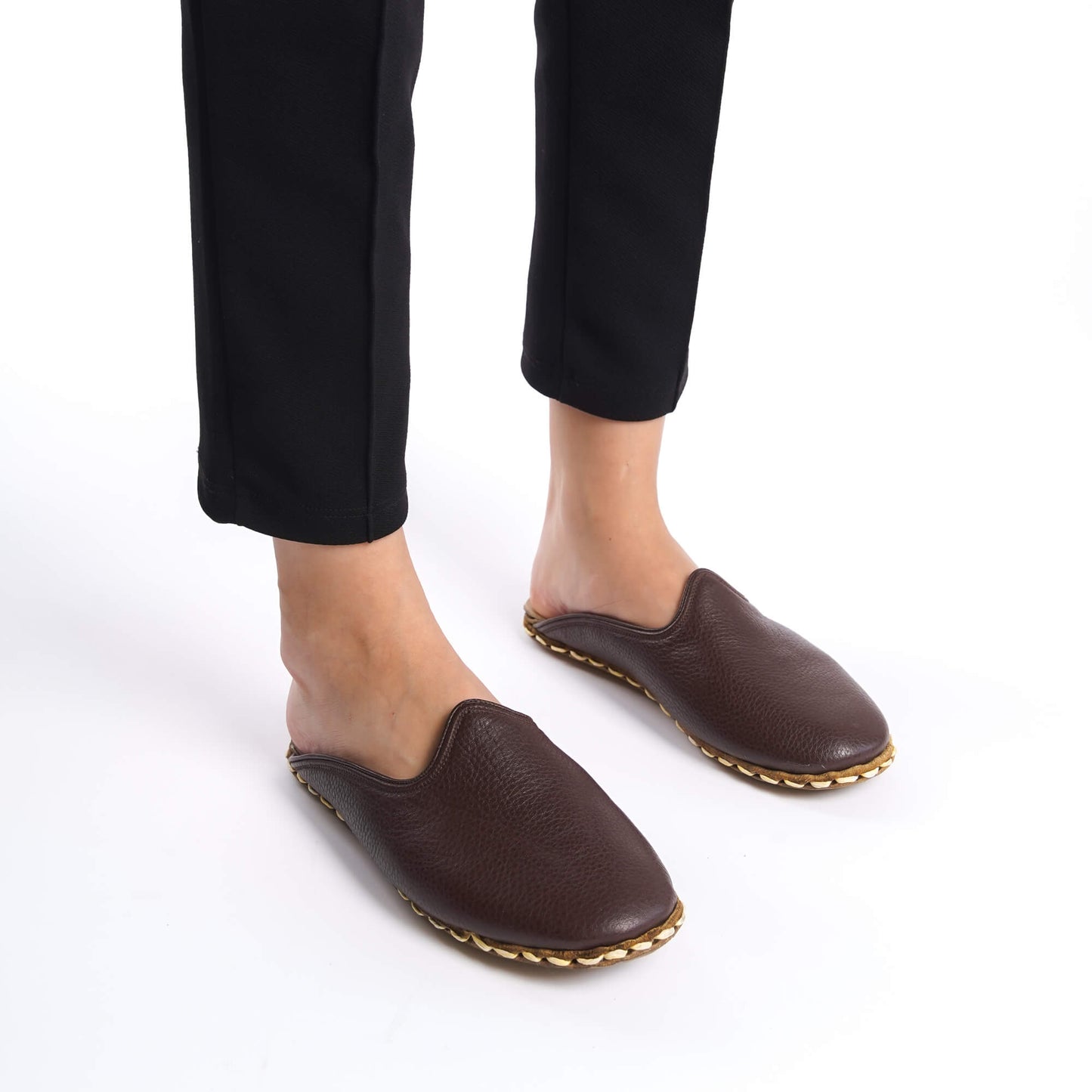 Classically styled coffee-brown leather slippers, hand-stitched for summer comfort.