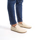 Close-up of Aeolia Leather Barefoot Men Loafers in beige worn with blue jeans - shop at pelanir.com.