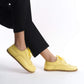 Close-up view of Doris Leather Barefoot Women's Oxfords in Yellow, perfect for elegant outfits