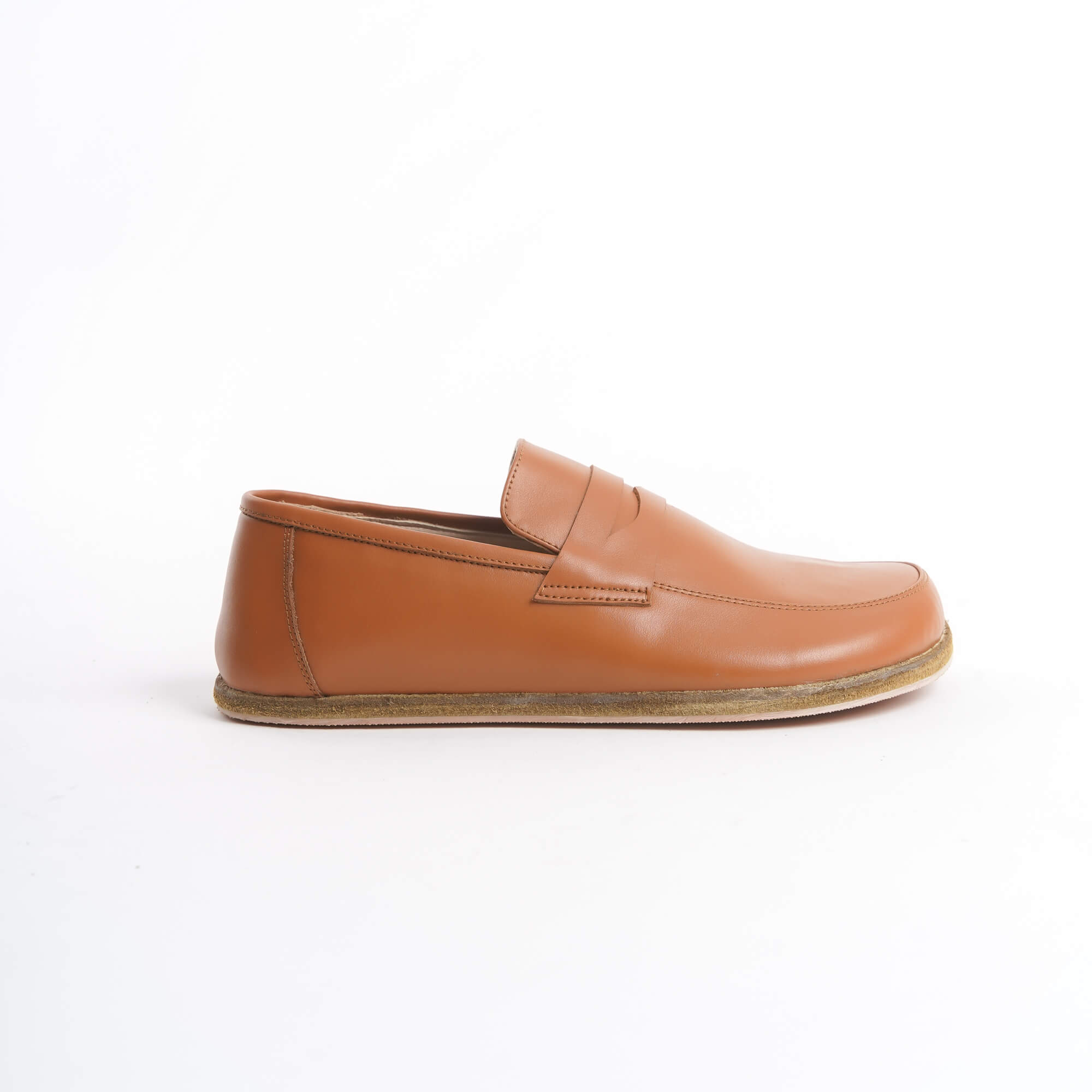 Close-up of Pelanir Sardis tan brown barefoot penny loafers. Crafted for natural movement with a breathable leather upper and an ultra-thin sole.
