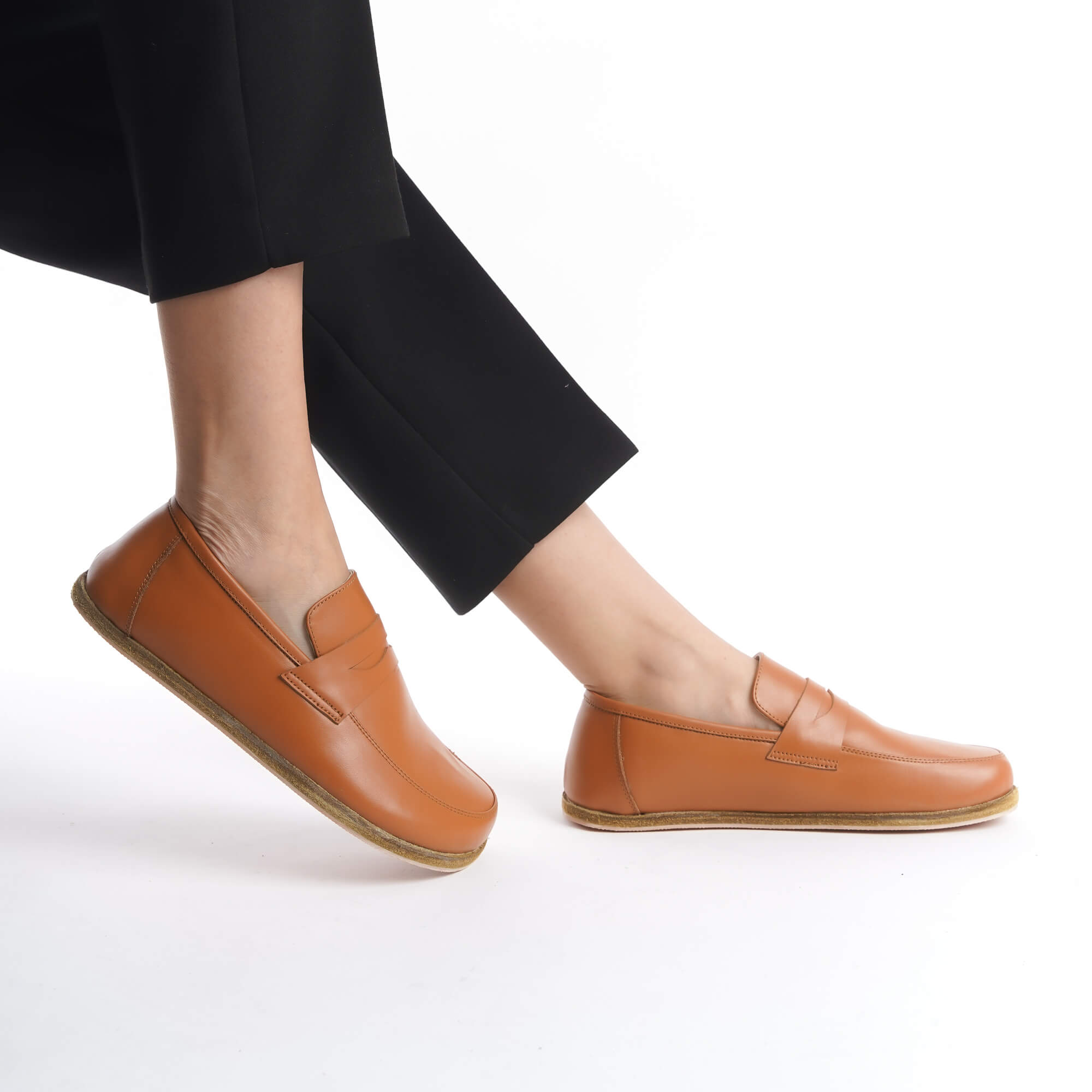 Side view of Pelanir Sardis tan brown barefoot penny loafer. Handcrafted from premium leather with a wide toe box and flexible sole for maximum comfort.