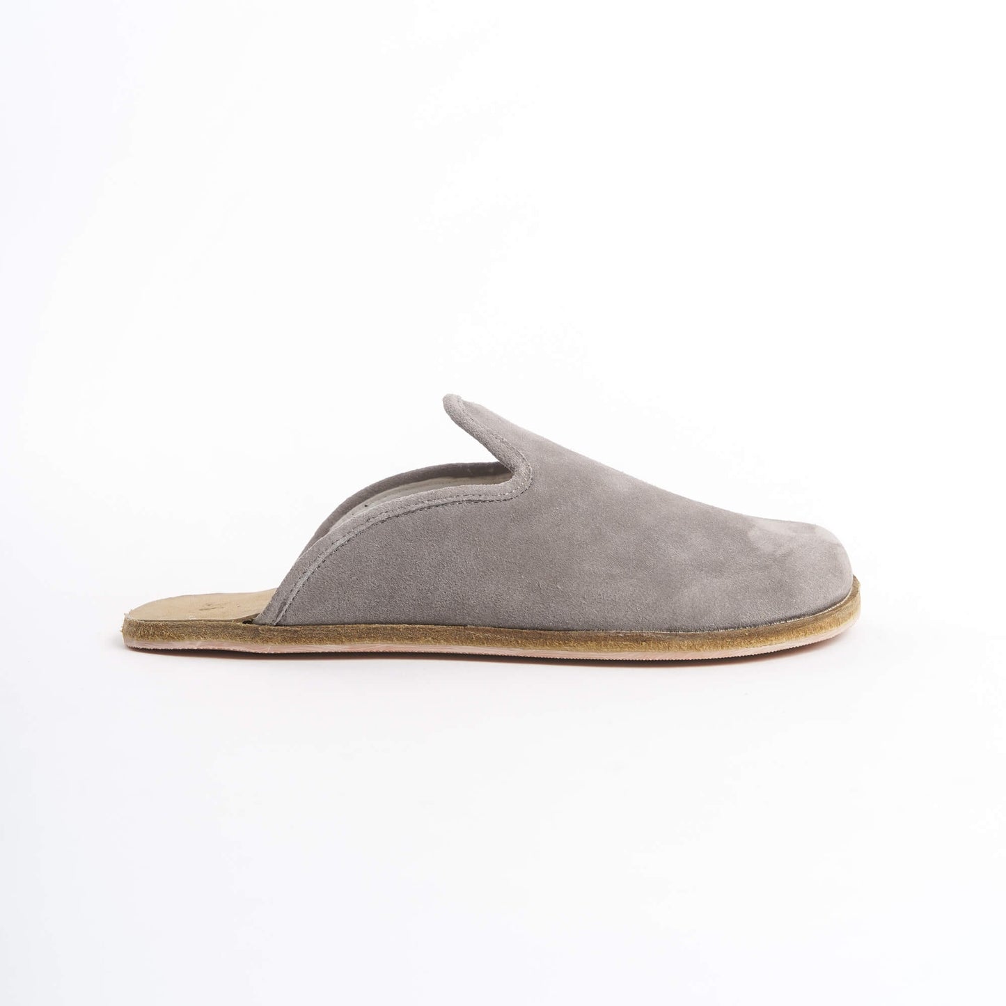 Sleek gray suede leather slip-on shoes for women, featuring a cushioned cork sole for all-day comfort. These eco-friendly and stylish shoes are perfect for U.S. professionals and casual wearers seeking versatile footwear.