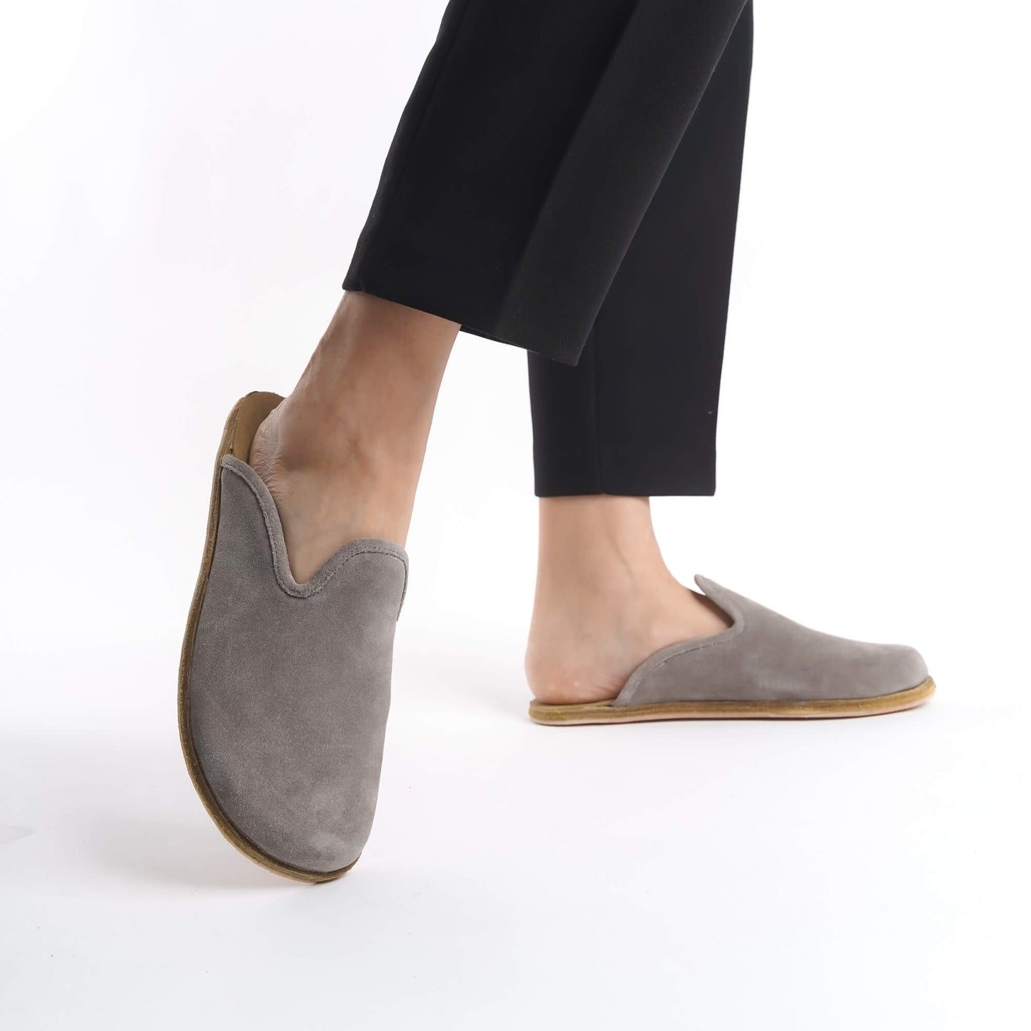 Chic gray suede leather slip-on shoes for women, crafted with a natural cork sole for excellent arch support. These durable, breathable shoes are a trendy yet eco-conscious choice for everyday style in the USA.