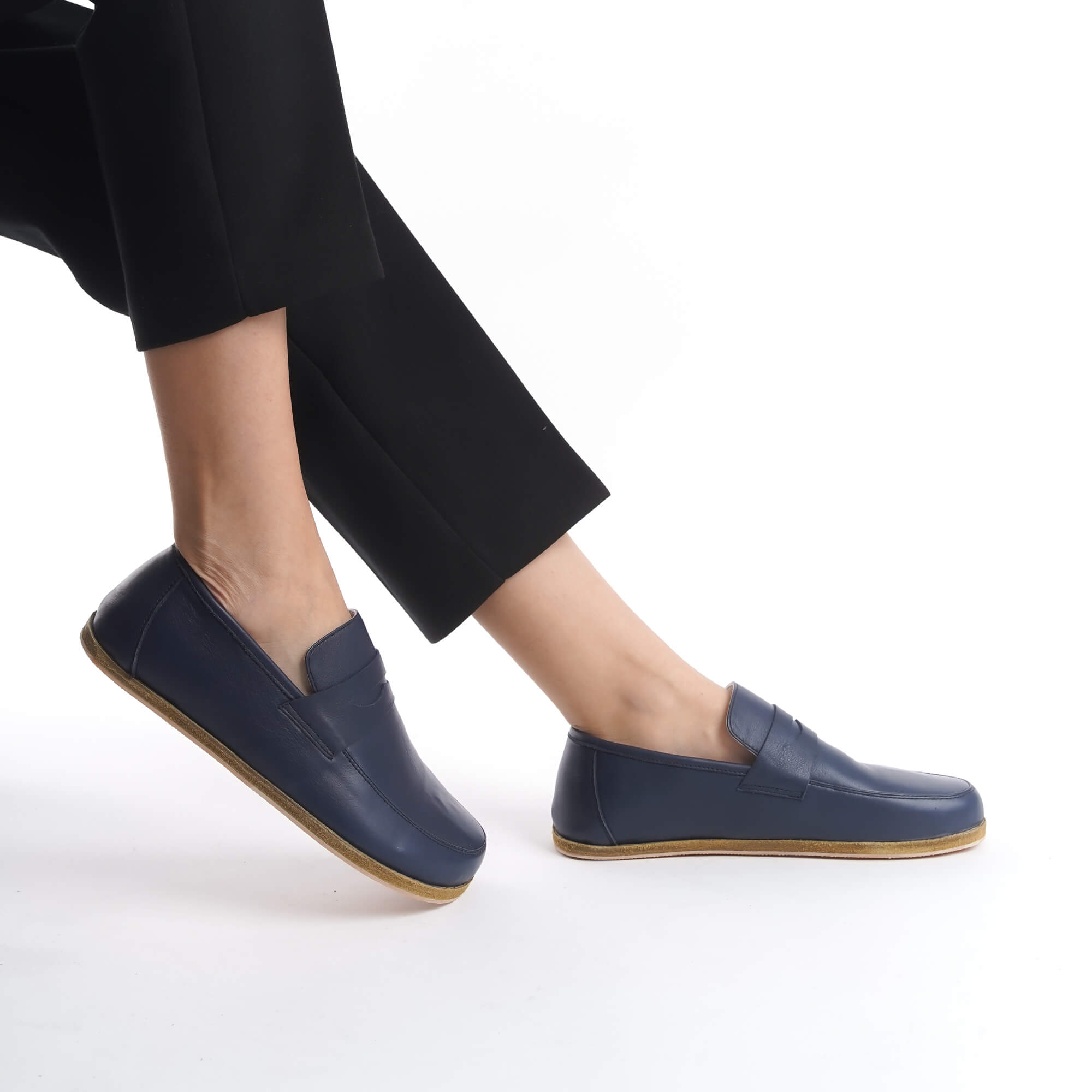 Side view of Pelanir Sardis navy blue barefoot penny loafer. Handcrafted from premium full-grain leather with a wide toe box and flexible sole for ultimate comfort.