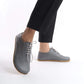 Model showcasing Doris Leather Barefoot Women's Oxfords in Gray with detailed stitching, paired with black pants