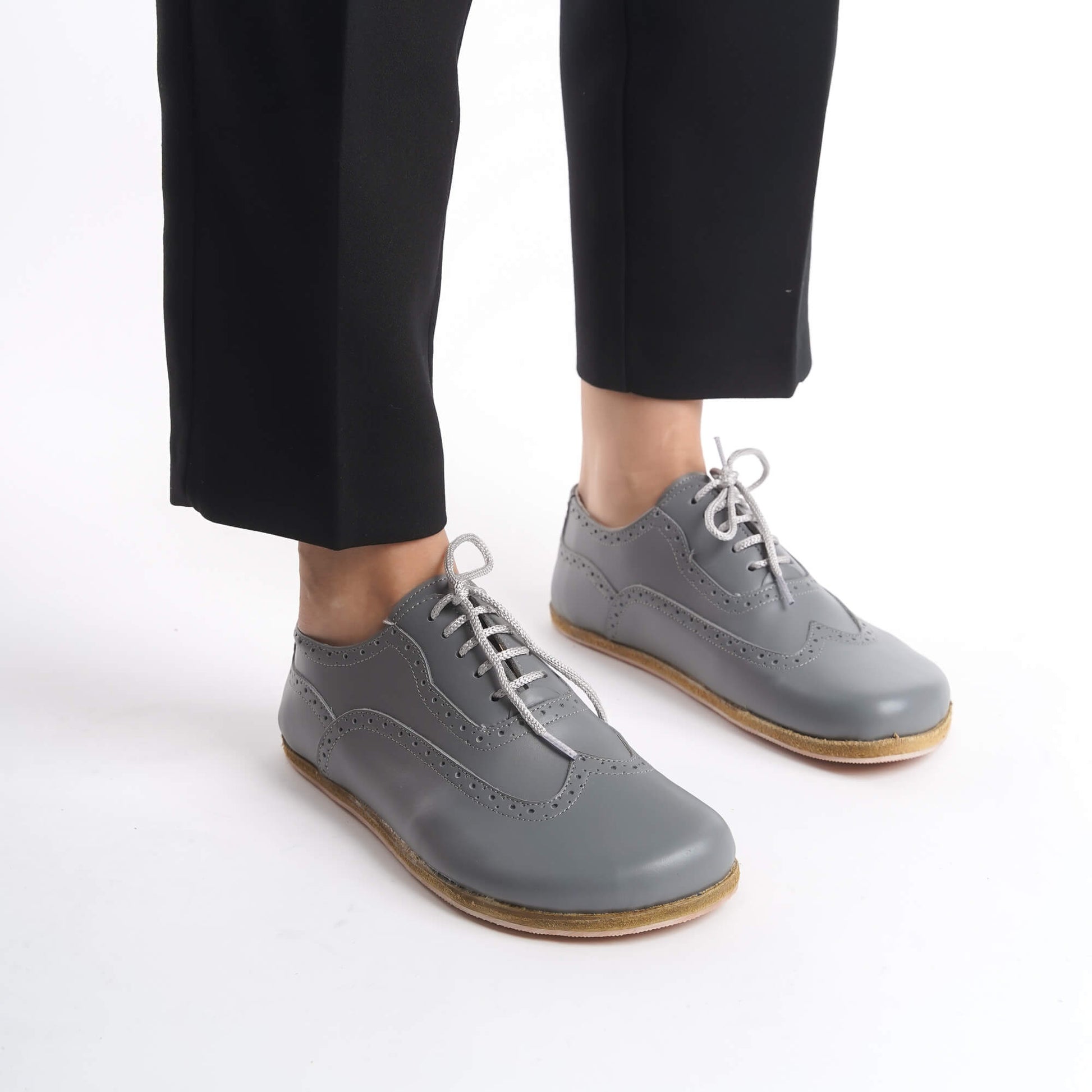 Close-up of gray Doris Leather Barefoot Women Oxfords showcasing intricate brogue details, available at pelanir.com.