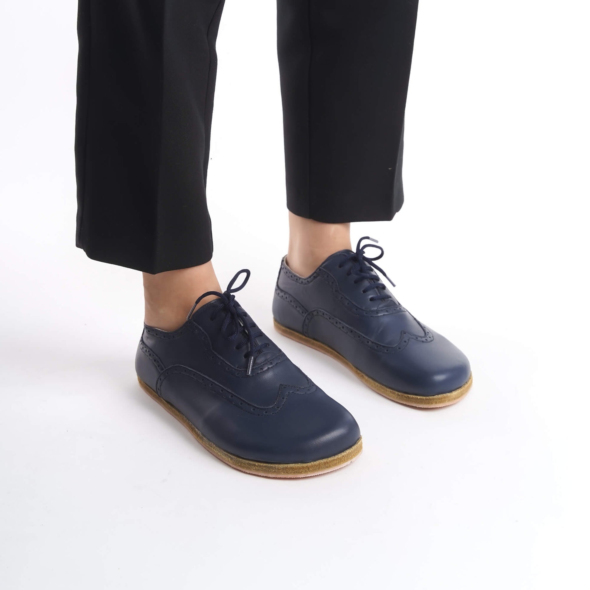 Close-up of Navy Blue Doris Leather Barefoot Women Oxfords showcasing intricate brogue details, available at pelanir.com.