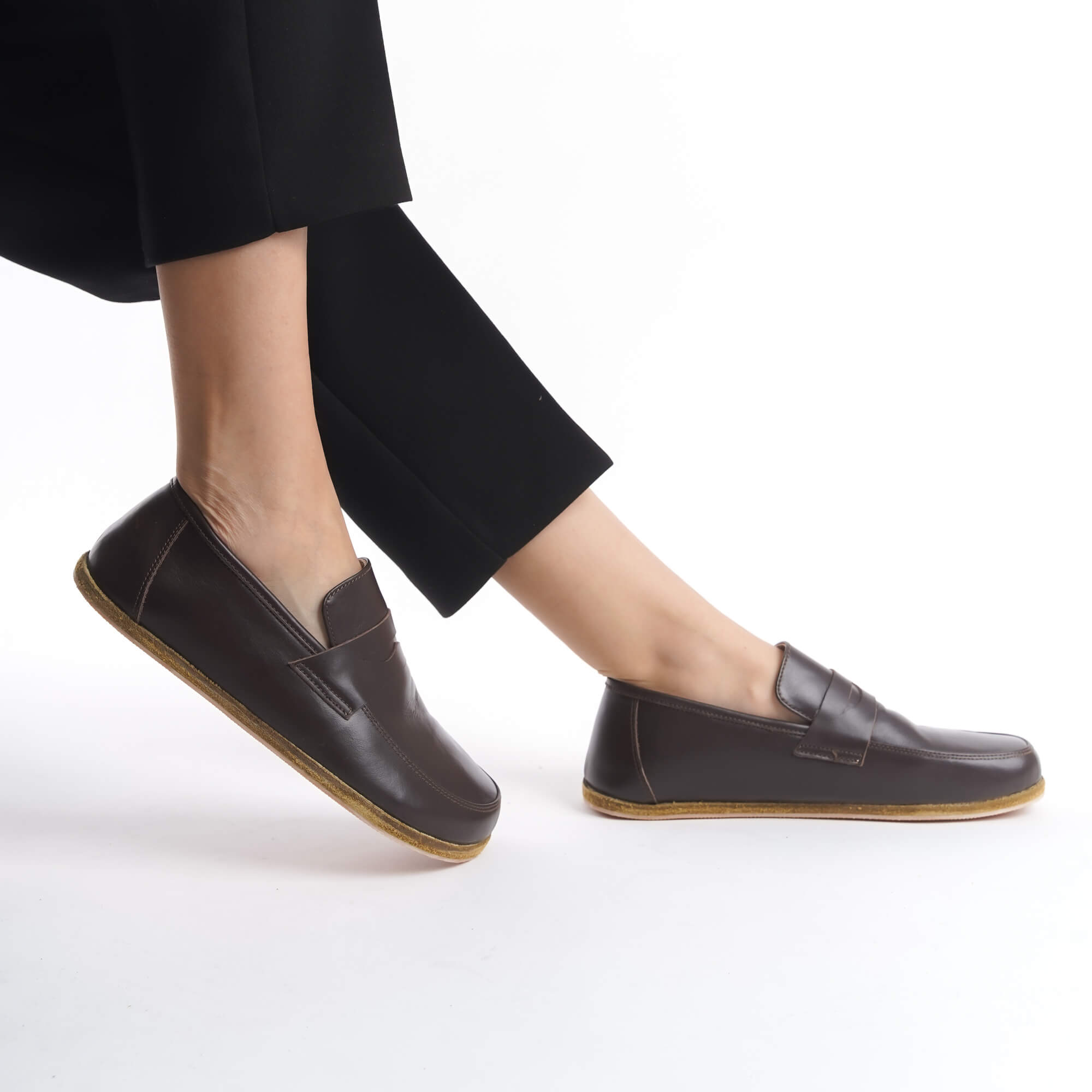 Side view of Pelanir Sardis brown barefoot penny loafer. Premium leather, flexible sole, and wide toe box for a lightweight, barefoot walking experience.
