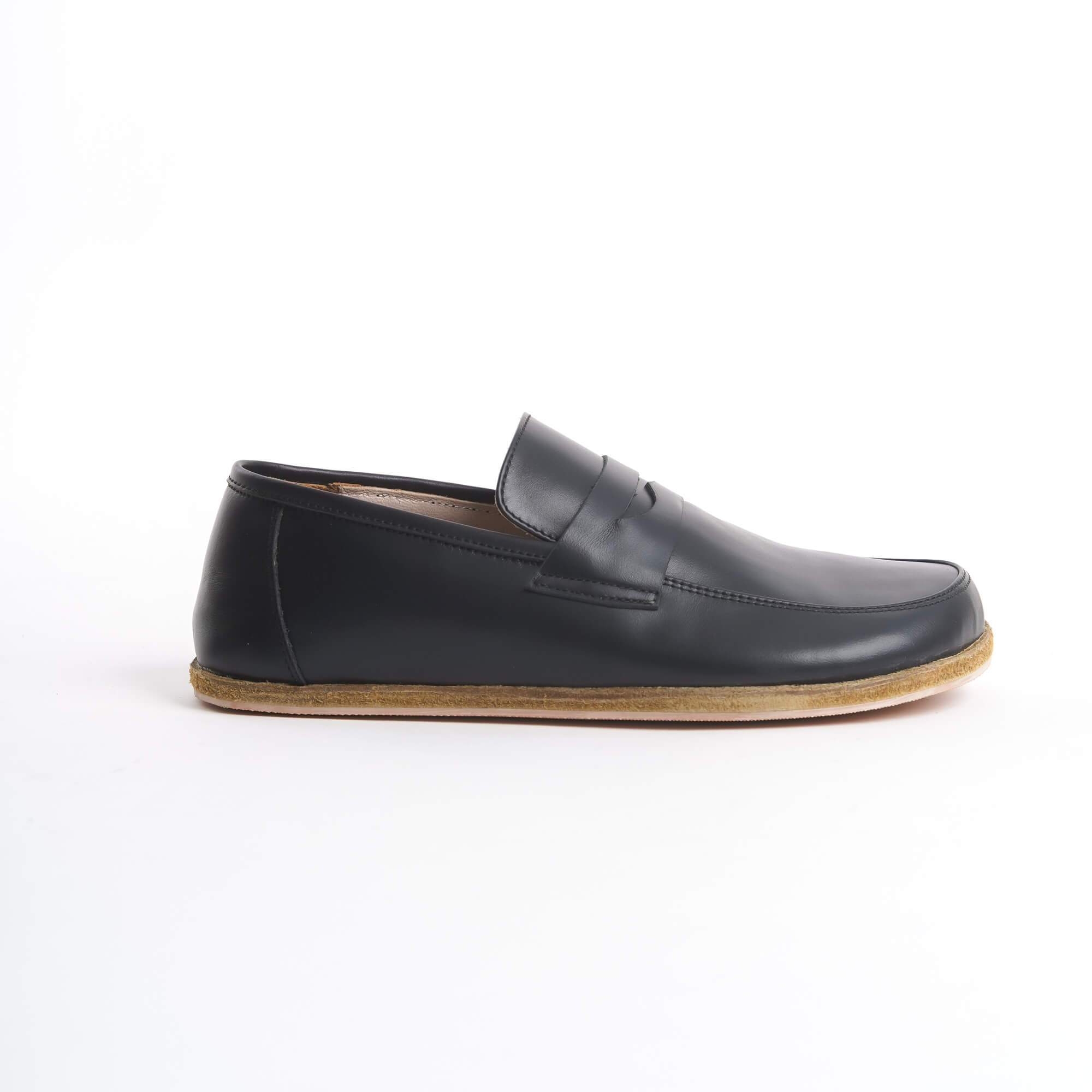 lose-up of Pelanir Sardis black barefoot penny loafers on feet. Premium leather, lightweight design, and wide toe box for natural foot movement.