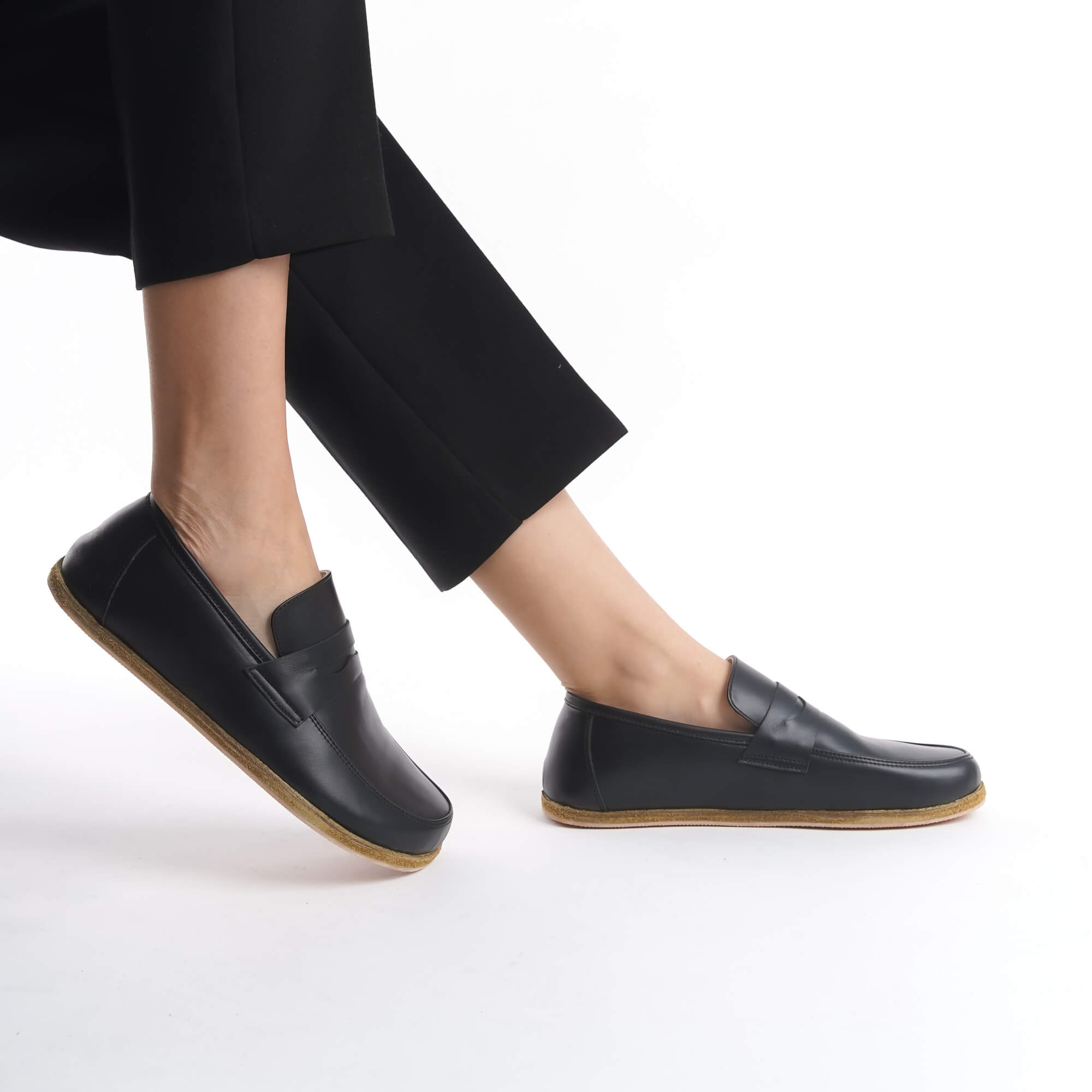 Side view of Pelanir Sardis barefoot penny loafer in black. Handcrafted from premium full-grain leather with a wide toe box and ultra-thin sole for a barefoot feel.