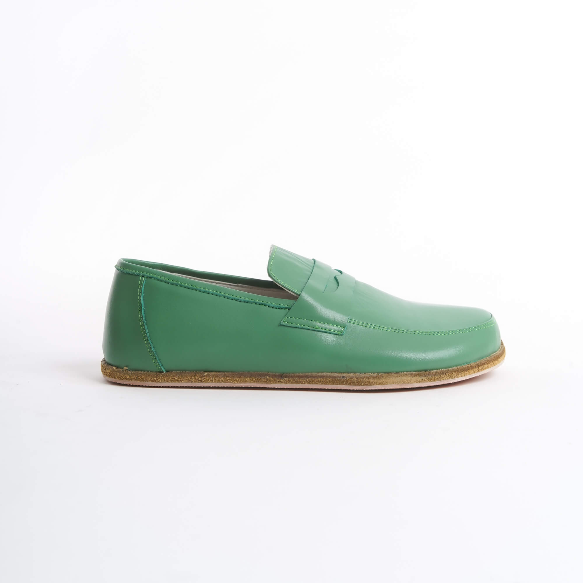 Close-up of Pelanir Sardis green barefoot penny loafers. Flexible, lightweight, and crafted from premium leather for ultimate comfort and natural movement.