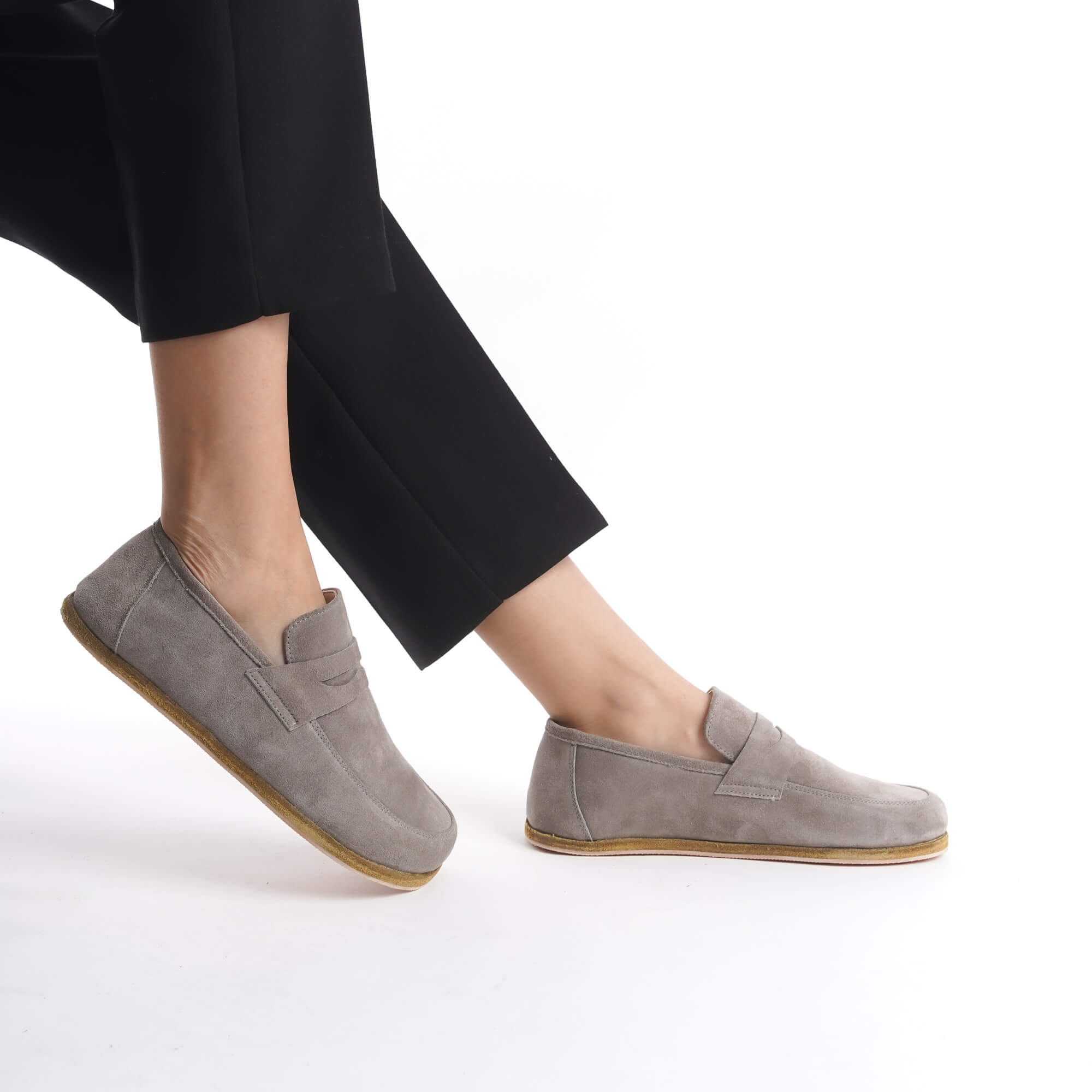 Side view of Pelanir Sardis gray suede barefoot penny loafer. Made from premium suede with a wide toe box and ultra-thin sole for a true barefoot feel.