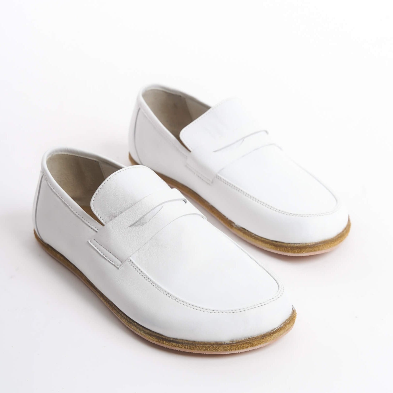 Pelanir Sardis white full-grain leather barefoot penny loafers. A minimalist, zero-drop design that combines timeless elegance with natural foot movement