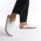 Modern white leather slip-on shoes with a cushioned cork sole, perfect for women looking for trendy yet comfortable footwear. These durable and breathable shoes are a must-have for U.S. shoppers seeking sustainable and stylish options.