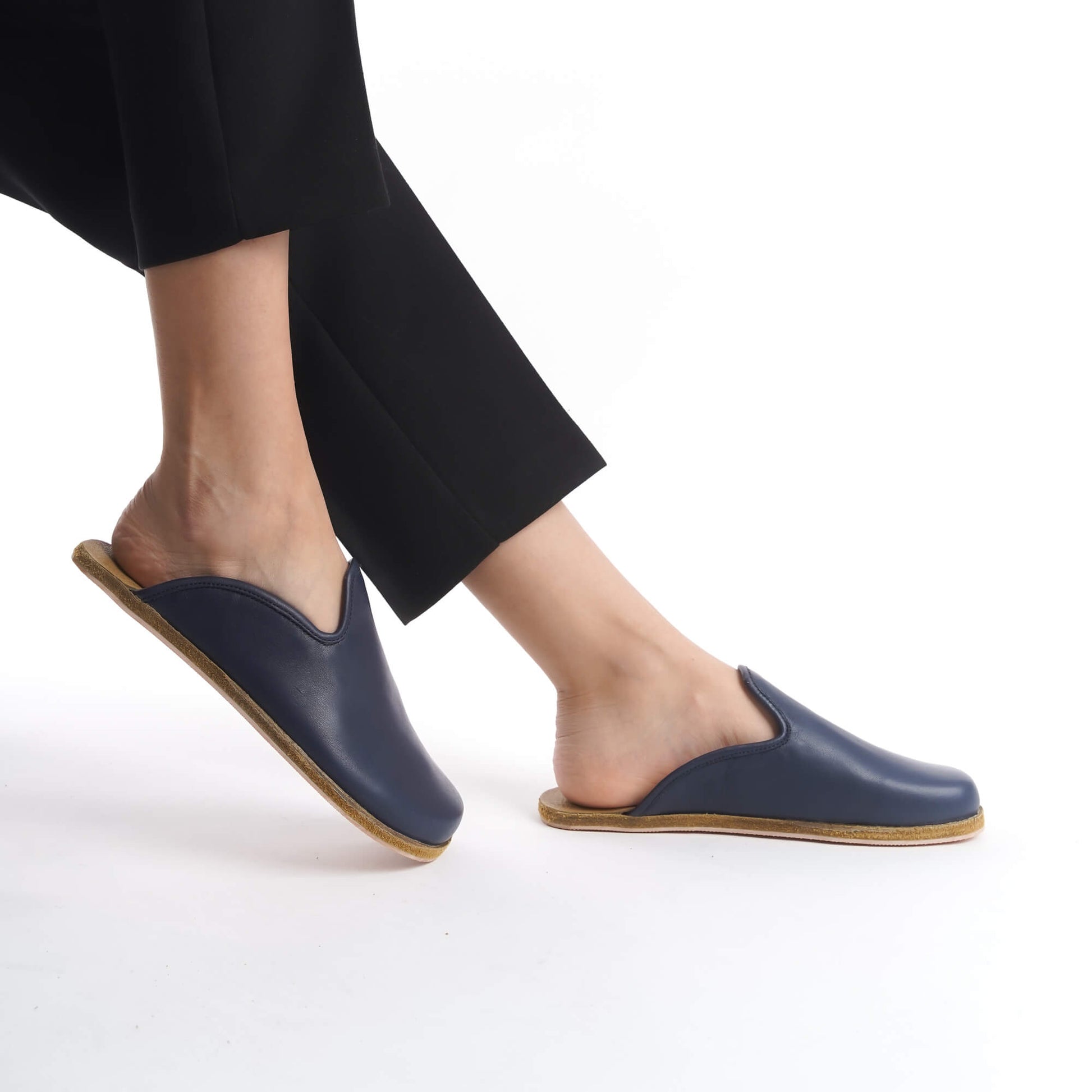 Elegant gray leather slip-on shoes with a supportive cork sole, designed for women seeking comfort and style. These sustainable footwear options enhance any wardrobe, offering flexibility and a lightweight feel for daily use in the U.S. market.