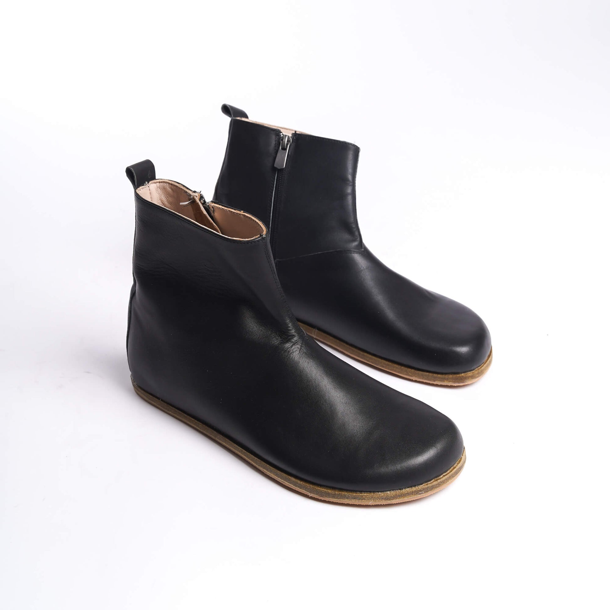 Pair of black ankle boots for men, crafted from genuine leather with a convenient side zipper for easy use.
