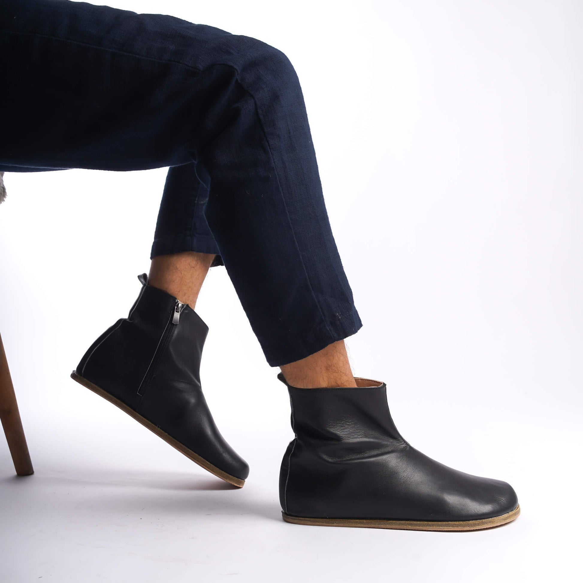 Men's black genuine leather barefoot ankle boots, designed with a sleek side zipper for effortless wear.