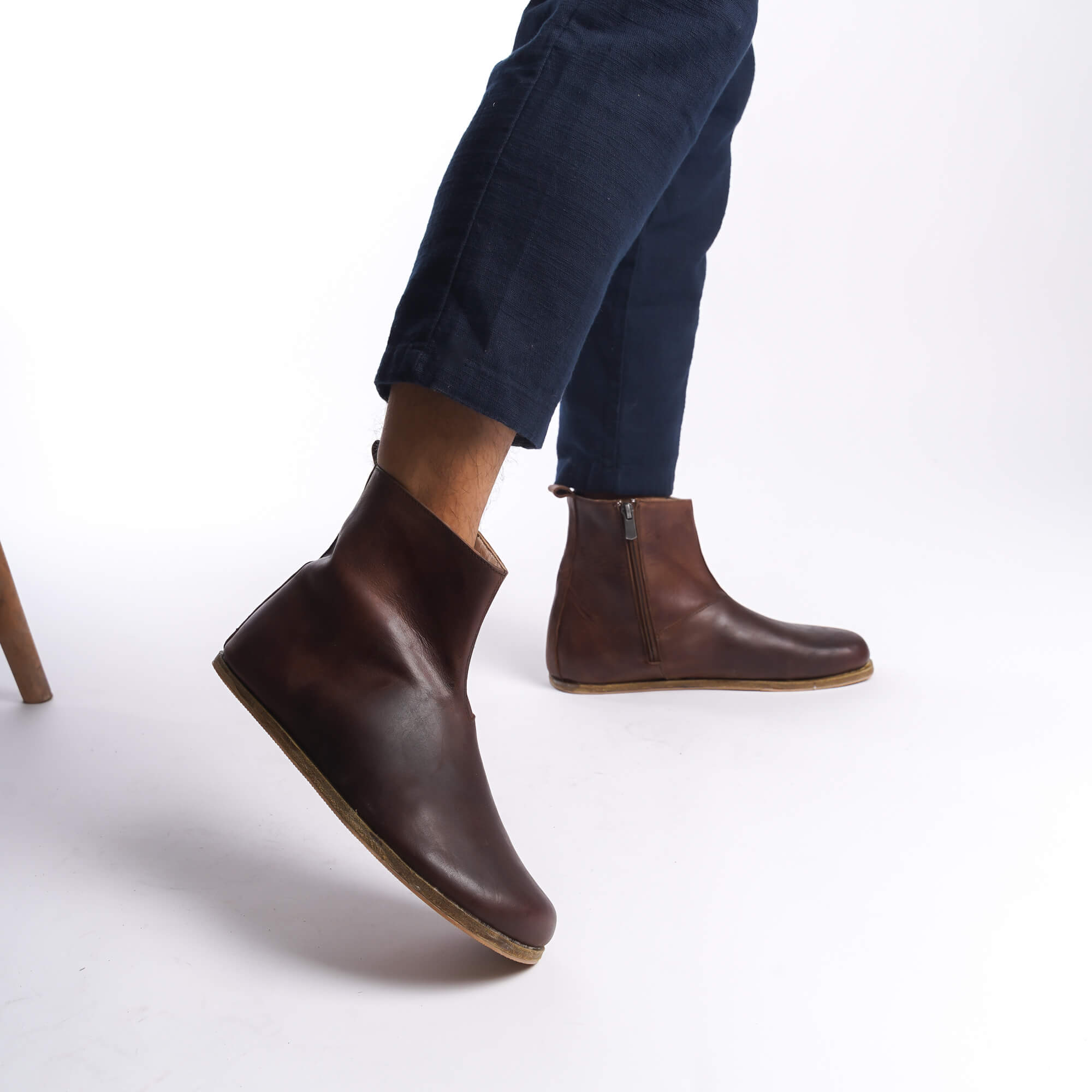 Brown leather barefoot ankle boots for men, perfect for winter, with a convenient zipper detail.