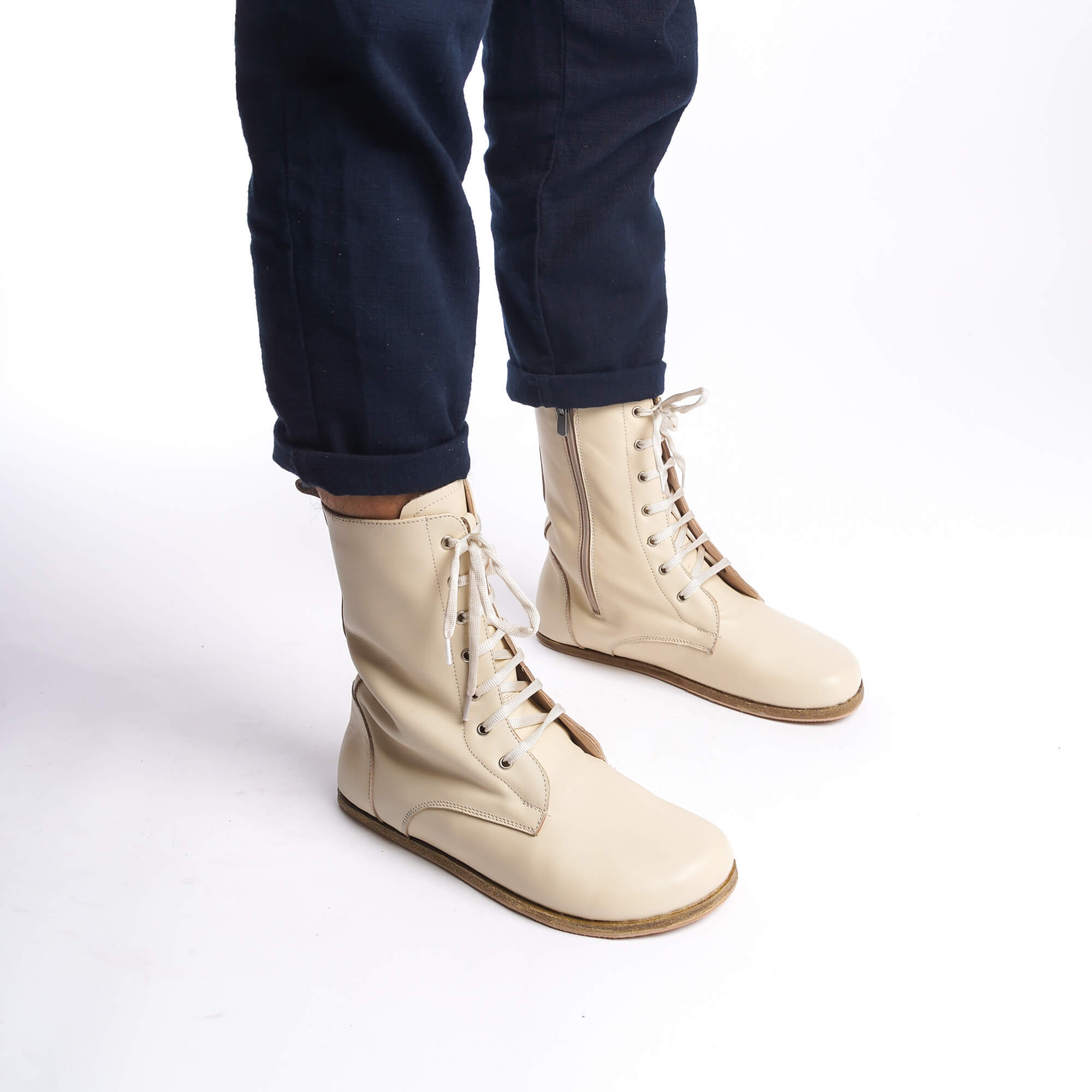 Side view of men's beige barefoot winter boots, highlighting the lace-up design and genuine leather material.