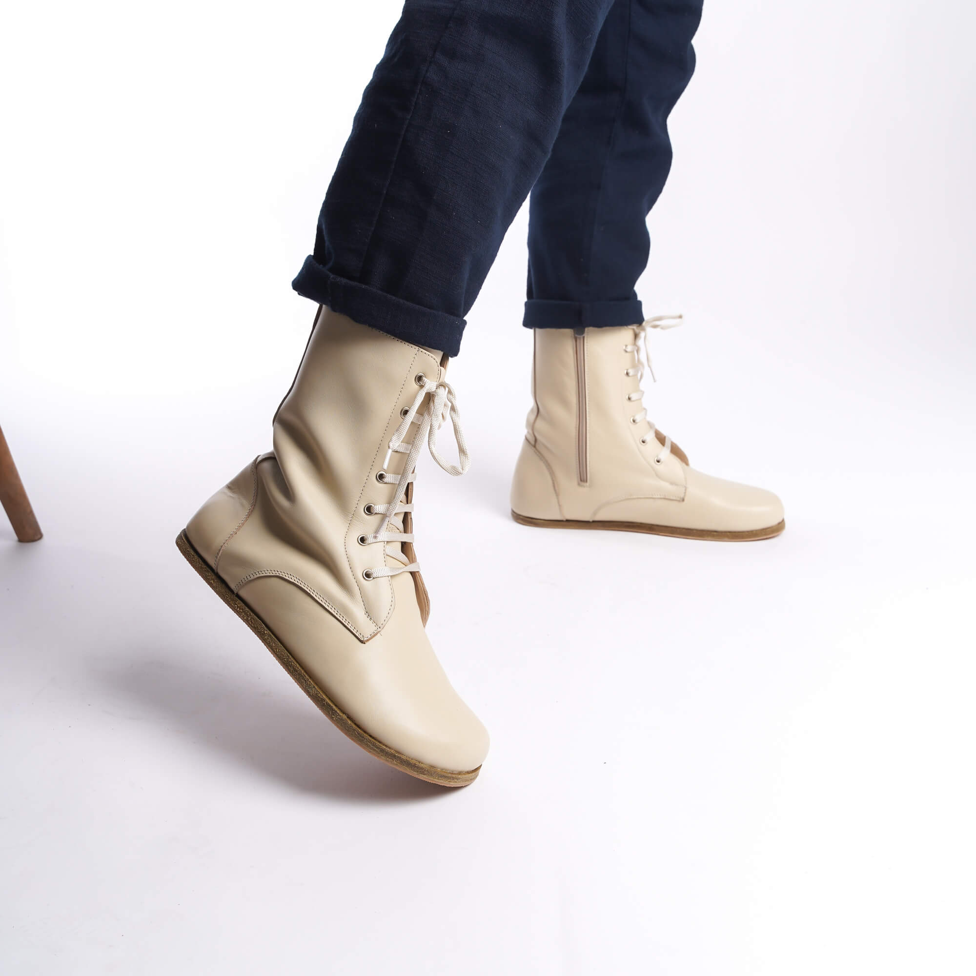 Men's beige leather barefoot boots, side profile with zipper detail, perfect for winter wear.
