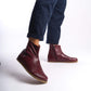 Burgundy leather barefoot ankle boots for men, perfect for winter, with an elegant zipper detail.