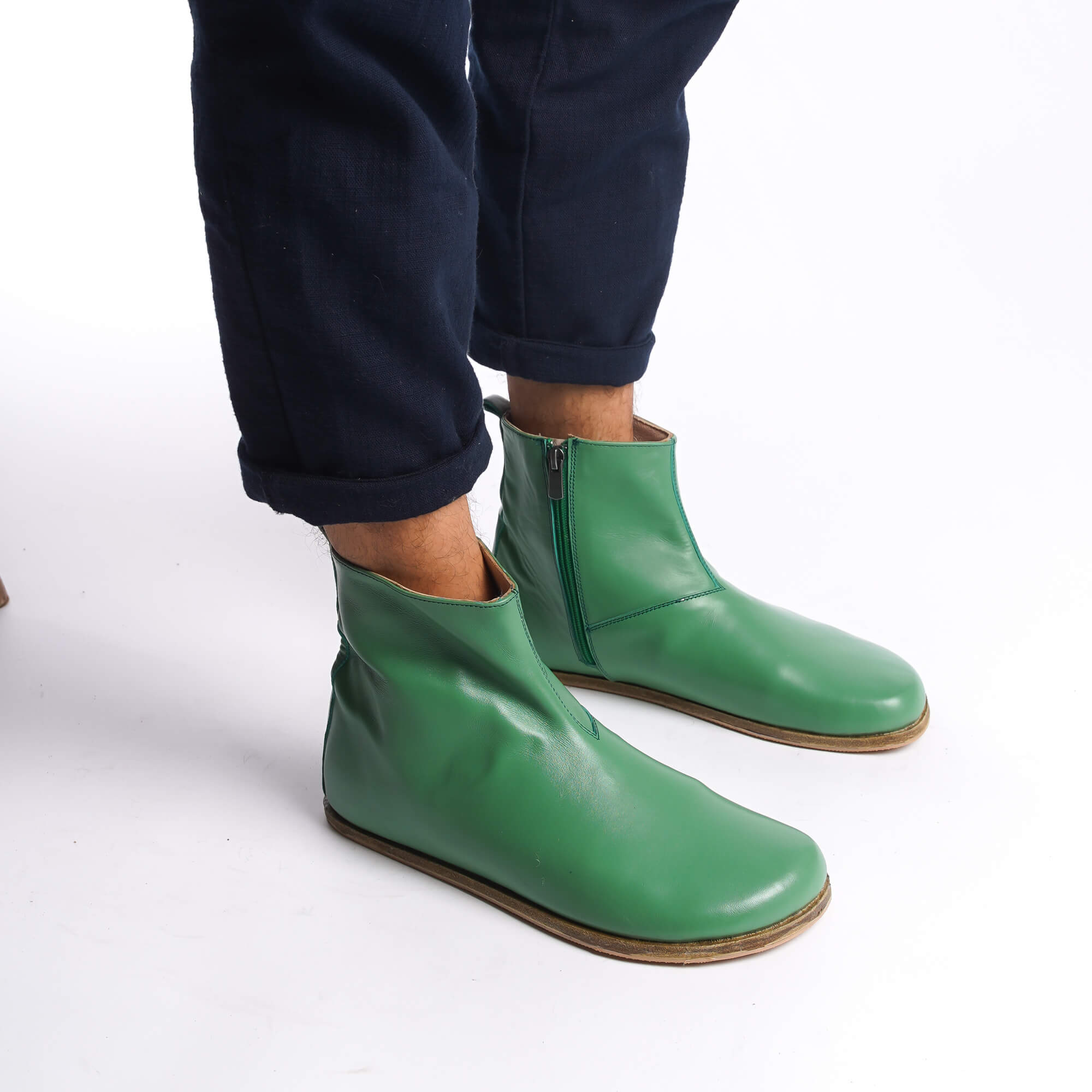 Green leather barefoot ankle boots for men, perfect for winter, with a stylish zipper detail.